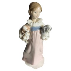 Lladro "Arms Full of Love" Girl Figurine by the world-renowned Spanish porcelain