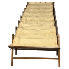 Early 20th-century vintage folding campaign bed or concertina bed