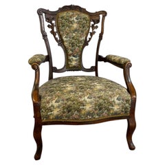 Antique Victorian parlor armchair showcasing masterful craftsmanship