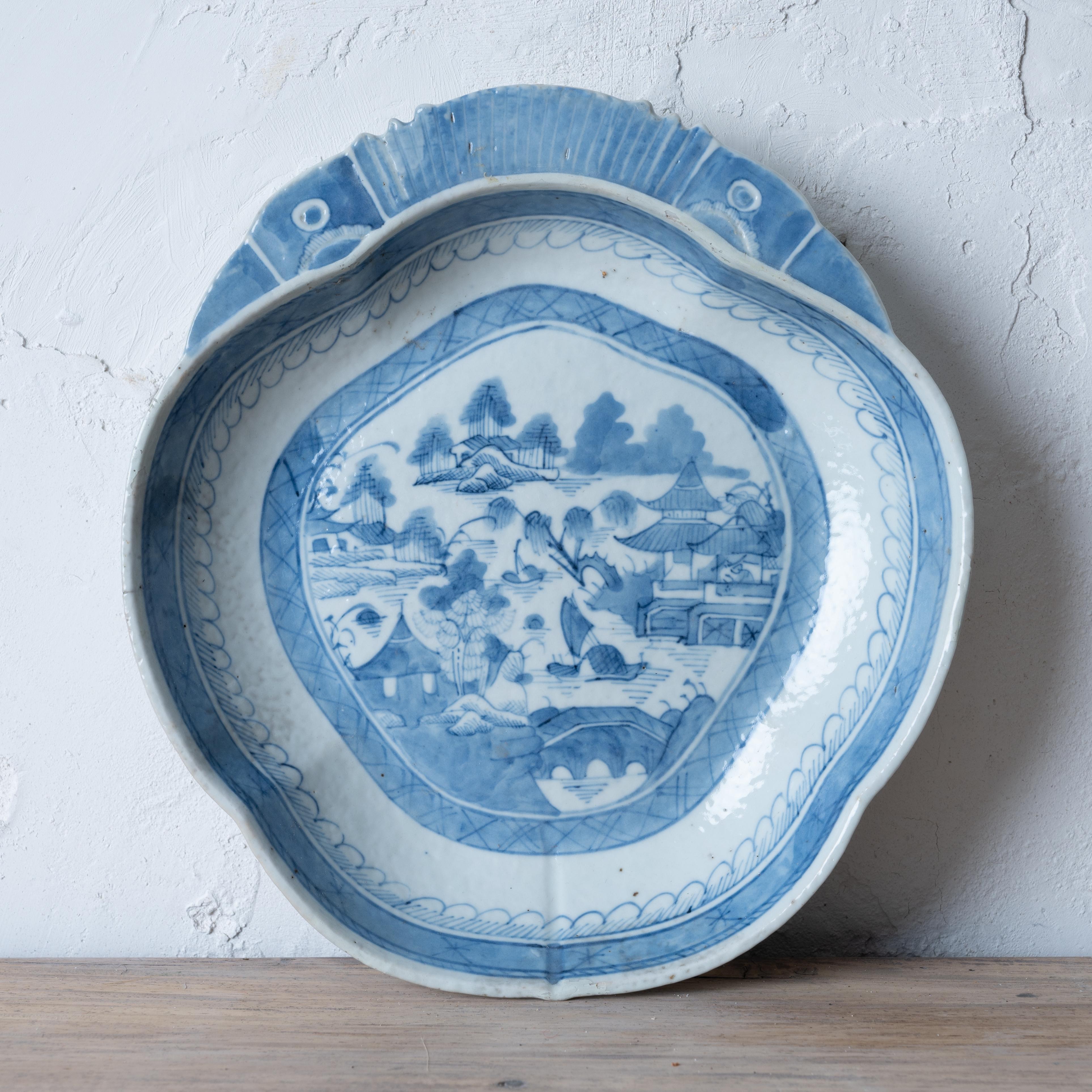 A Chinese Canton blue and white shrimp dish, circa 1850.



9 ¼ inches wide by 10 inches long by 1 ½ inches tall



