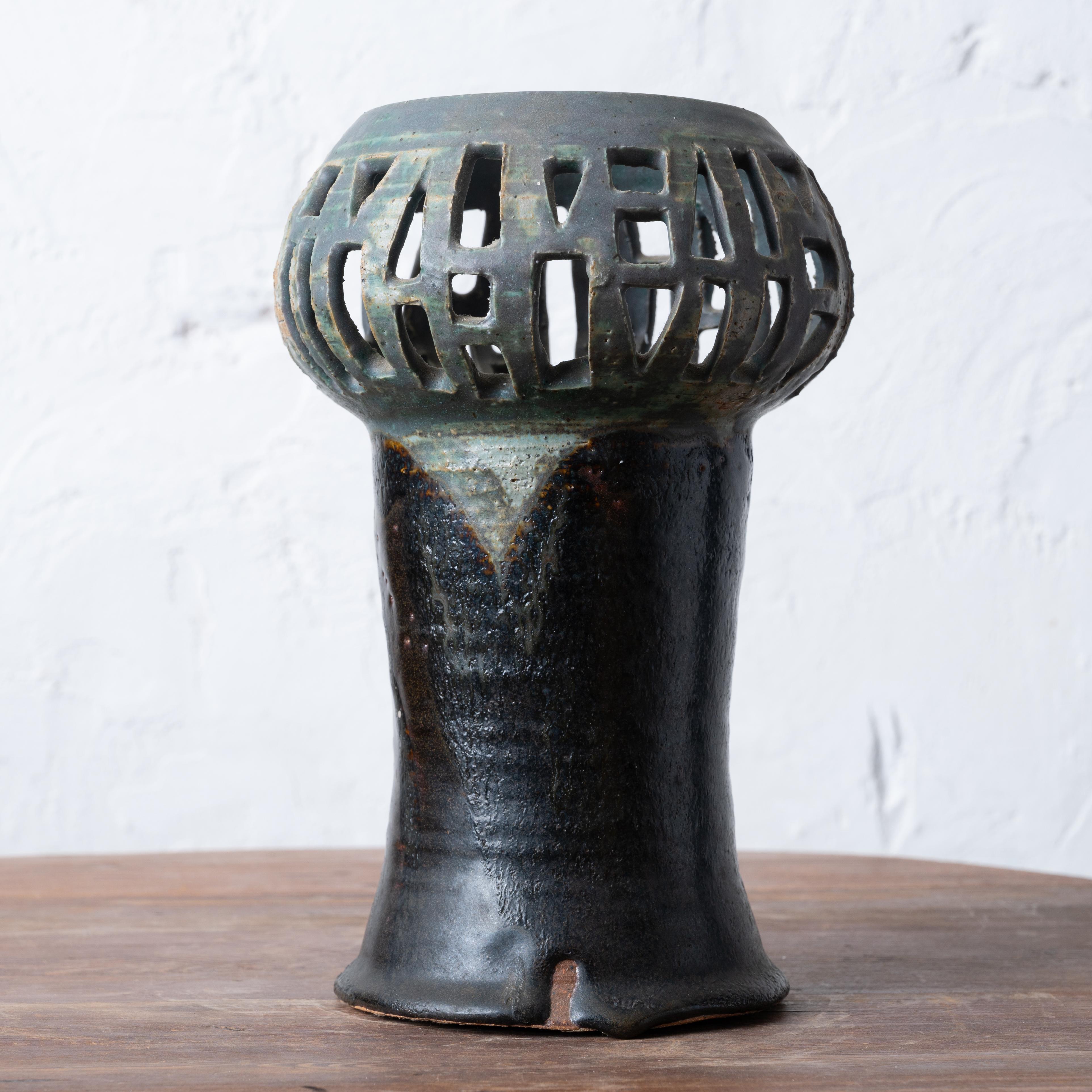 A ceramic pottery lantern attributed to Natzler Studios, circa 1950.



6 ½ inches wide by 9 ¾ inches tall



