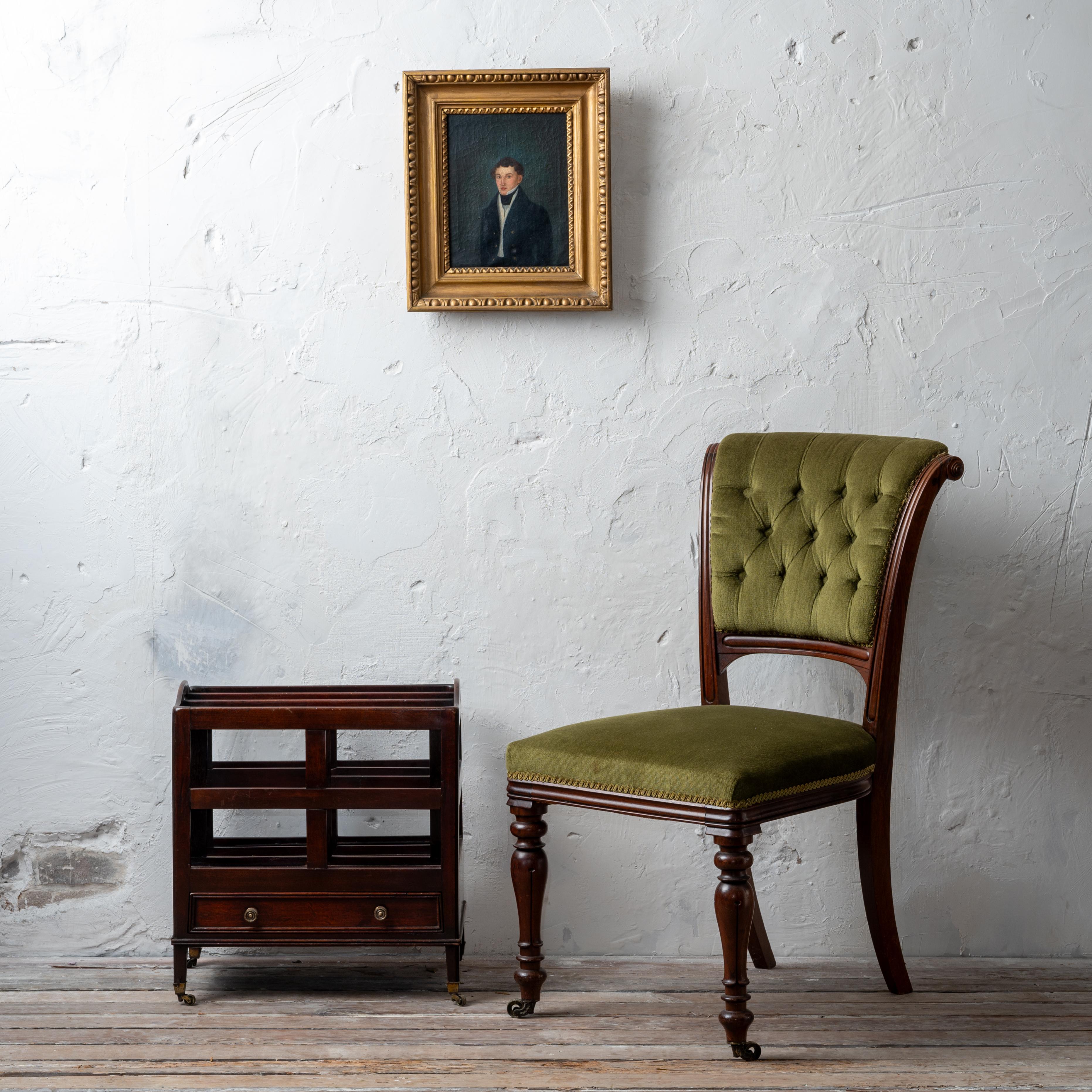 An early Victorian mahogany side chair in green velvet tufted upholstery, 1840s.



18 ½ inches wide by 25 inches deep by 36 inches tall 



