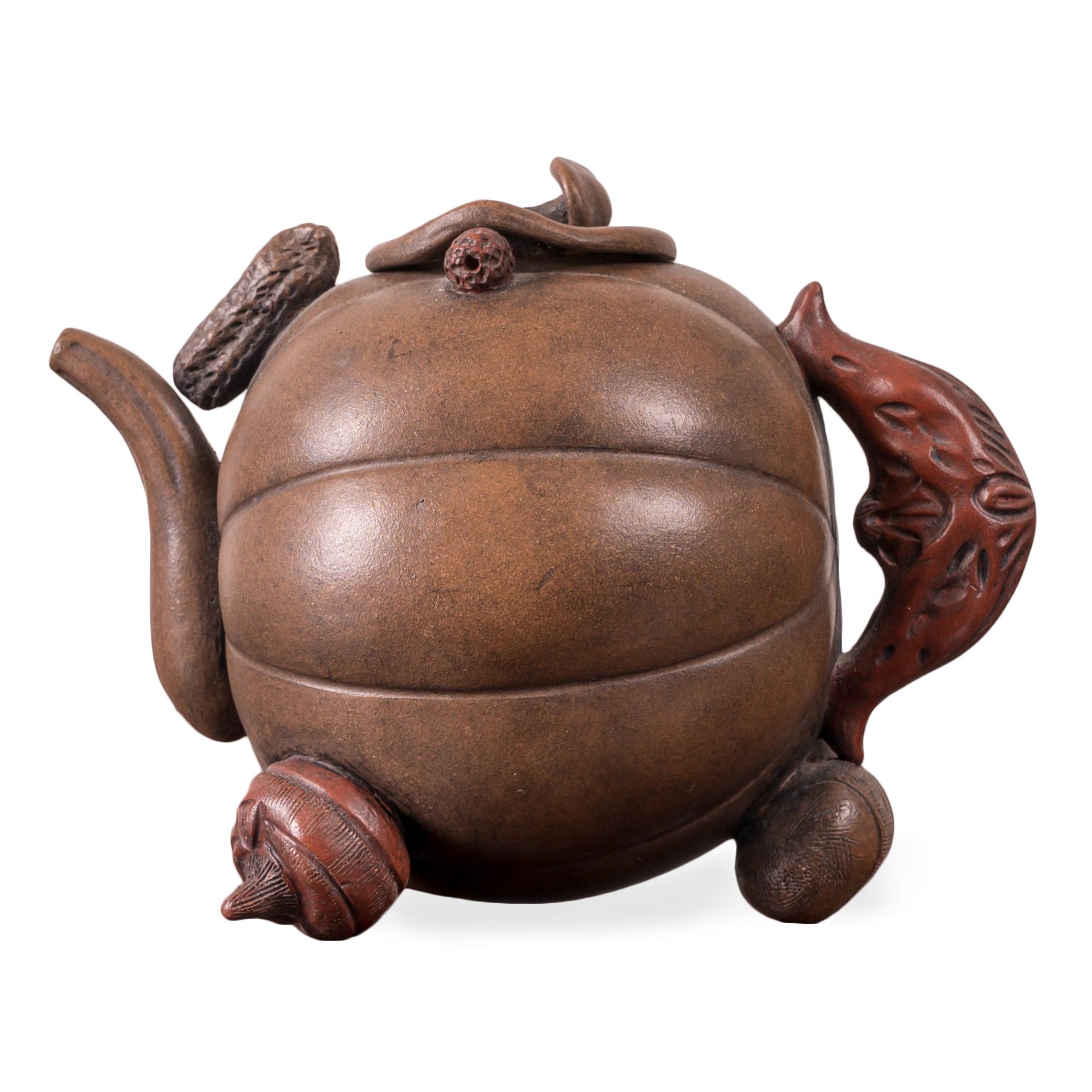 A Yixing Zisha ‘Hundred-Fruit’ pumpkin teapot.



6 inches wide by 4 inches deep by 4 inches tall



