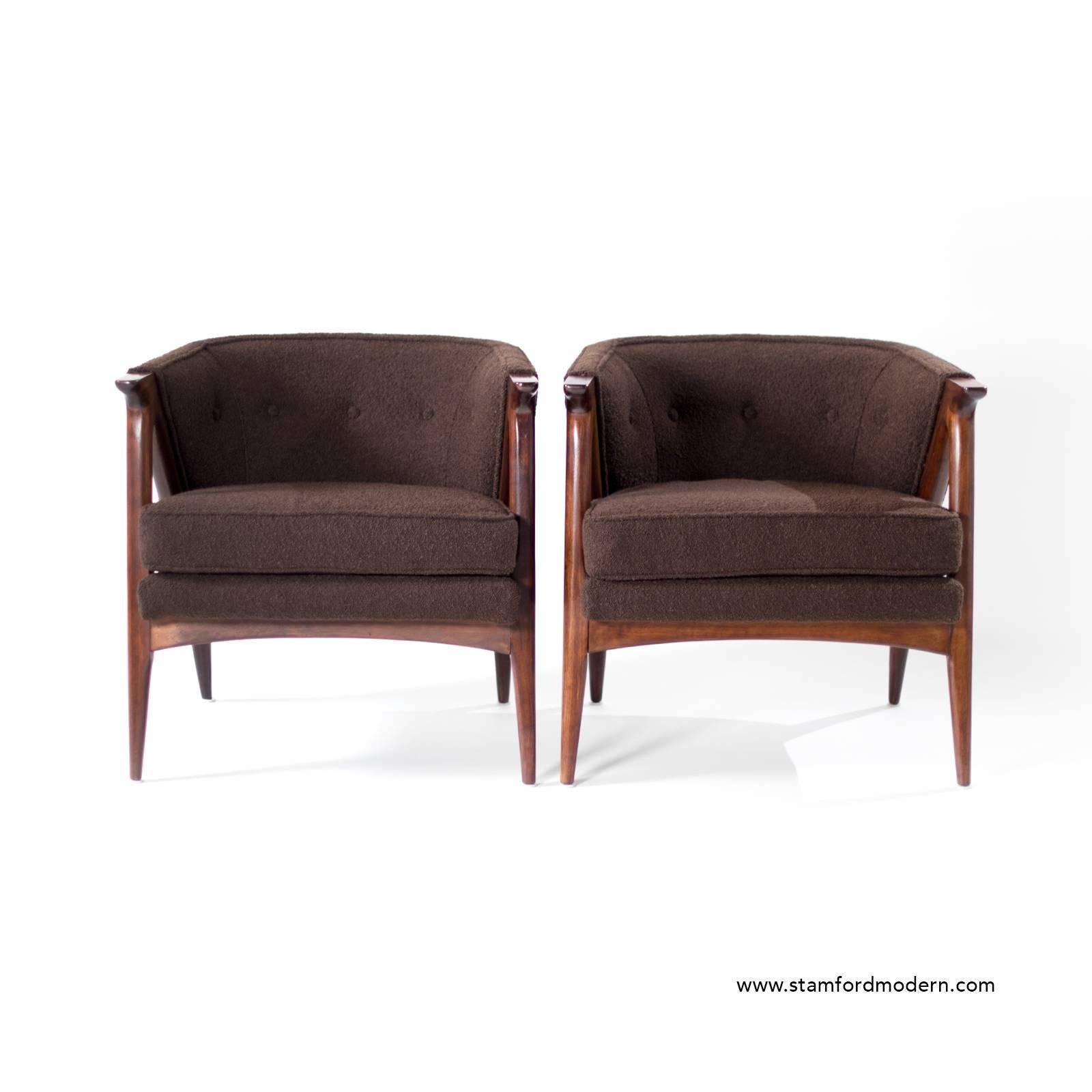 Pair of fully restored Danish modern lounge chairs, circa 1950s. Sculptural walnut frames fully restored, newly upholstered in brown boucle.
