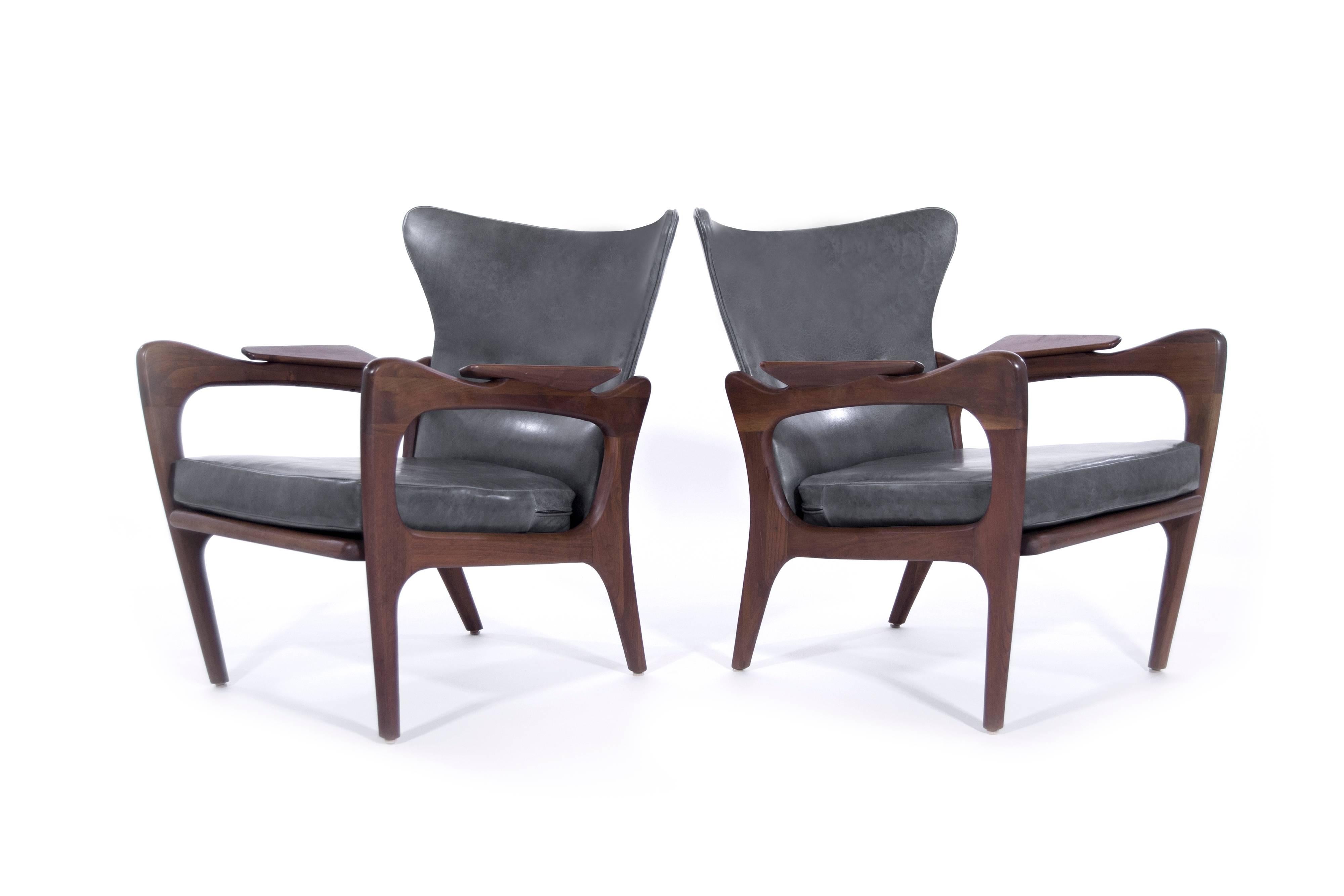 Adrian Pearsall wingback lounge chairs for Craft Associates, model 2291-C, in excellent restored condition. Sculptural walnut frames have been fully restored. They boast hand-cut foam and are newly re-upholstered in Echo Granite leather by Moore &