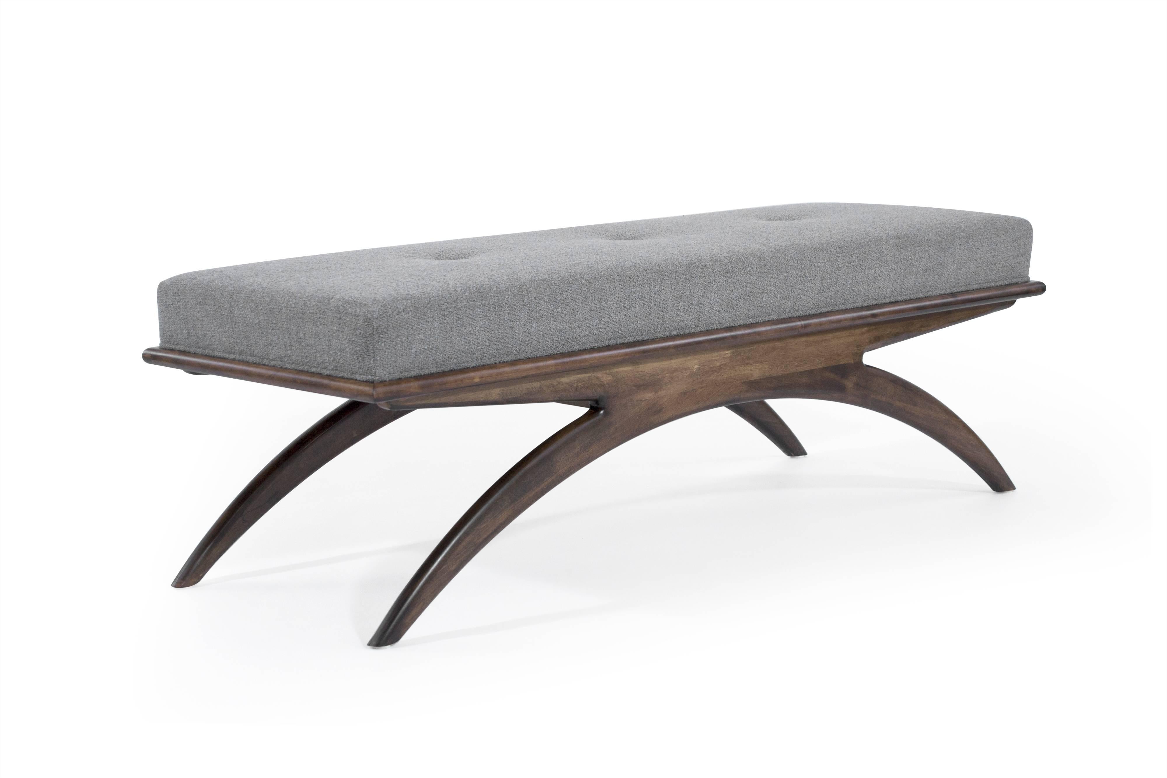 Artistically handcrafted from solid walnut featuring tapered arched legs underneath an upholstered top. The design is largely inspired by iconic Italian furniture designer Gio Ponti. We are proud to mimic his tradition of making pieces that are