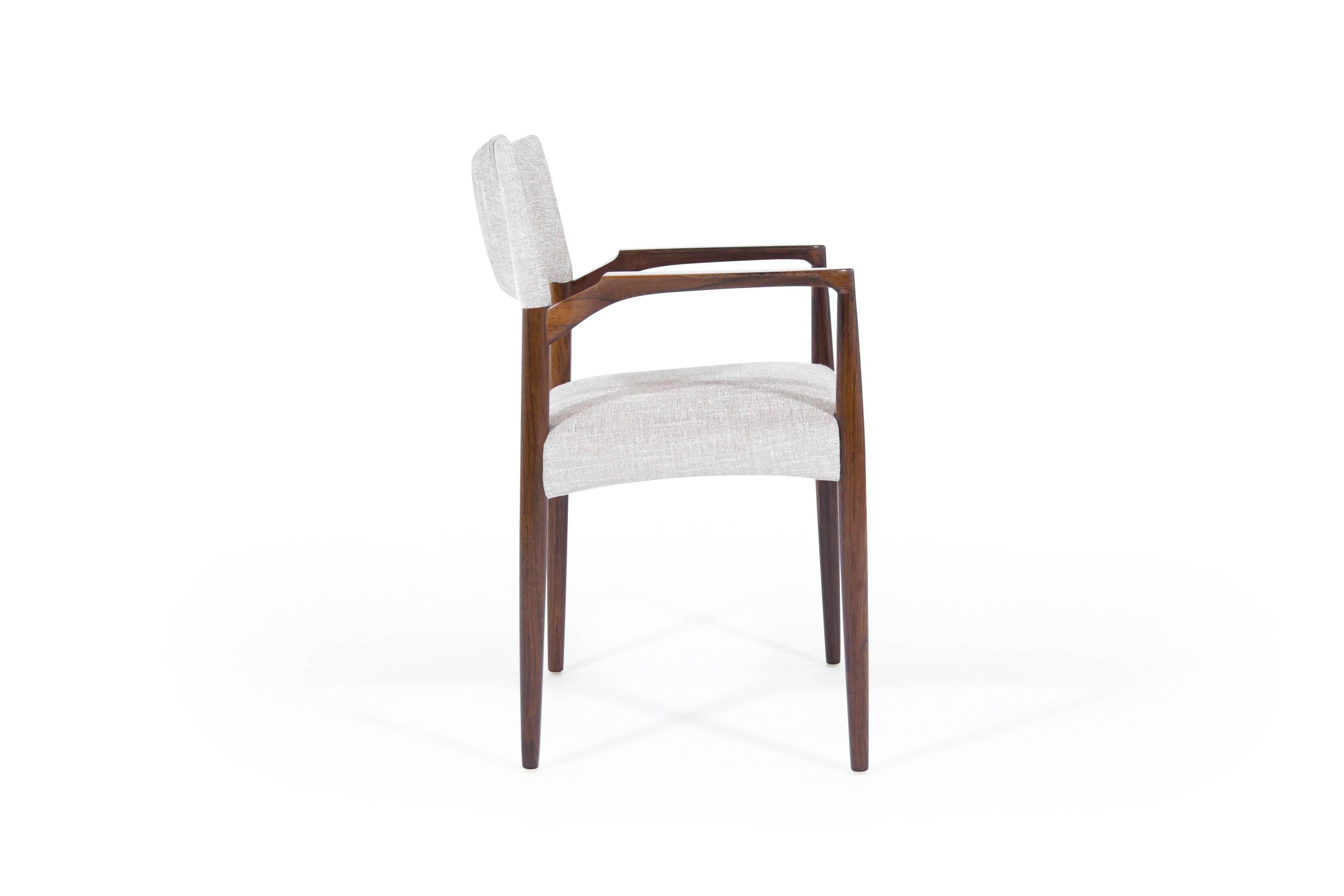 Rare rosewood armchair by Aksel Bender Madsen. Beautifully crafted, very comfortable and supportive. Newly upholstered in beige linen. Fully restored rosewood has beautiful hues and good clear grain throughout.