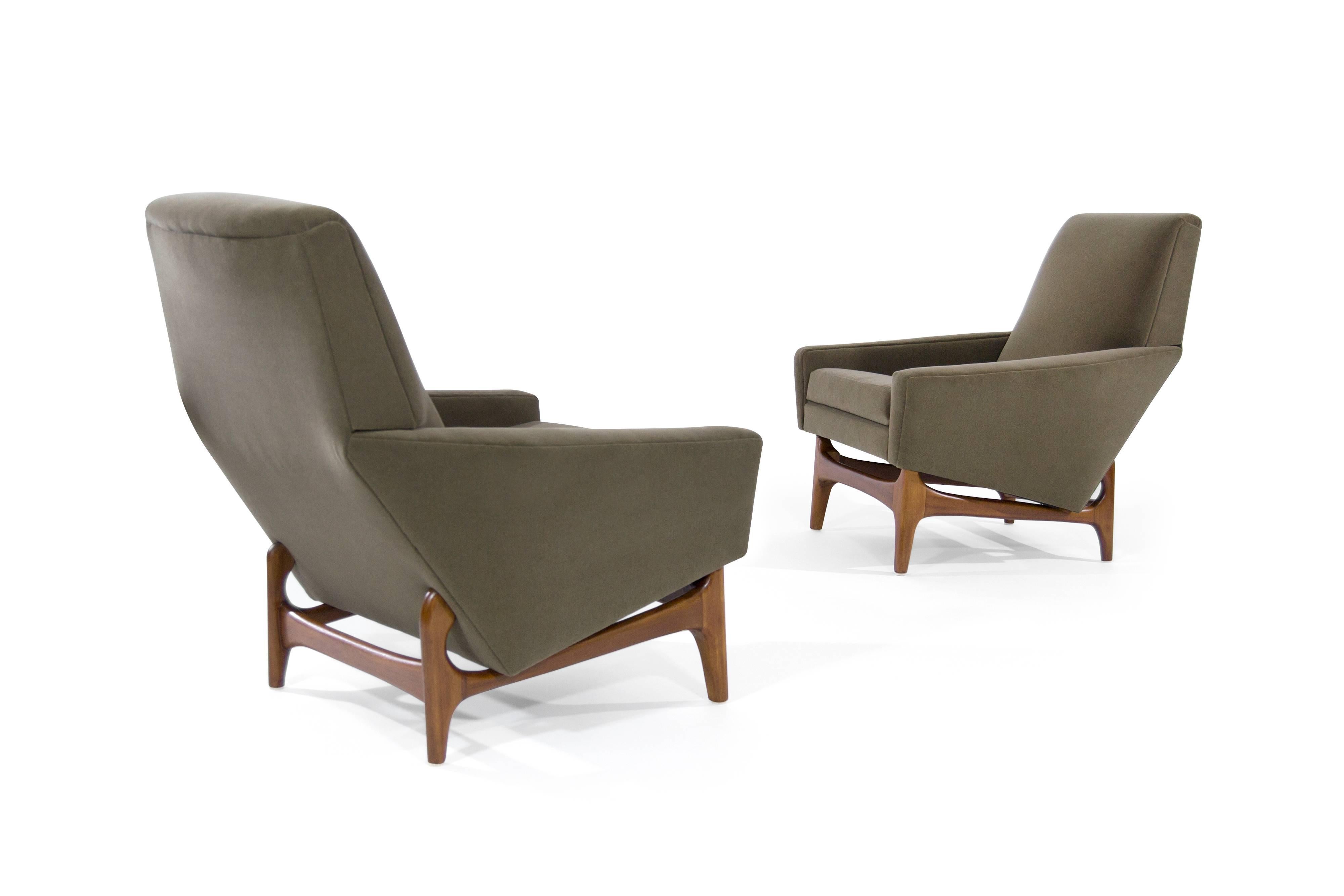 Handsome pair of Danish-Modern lounge chairs, newly recovered in olive velvet. Sculptural teak bases fully restored.