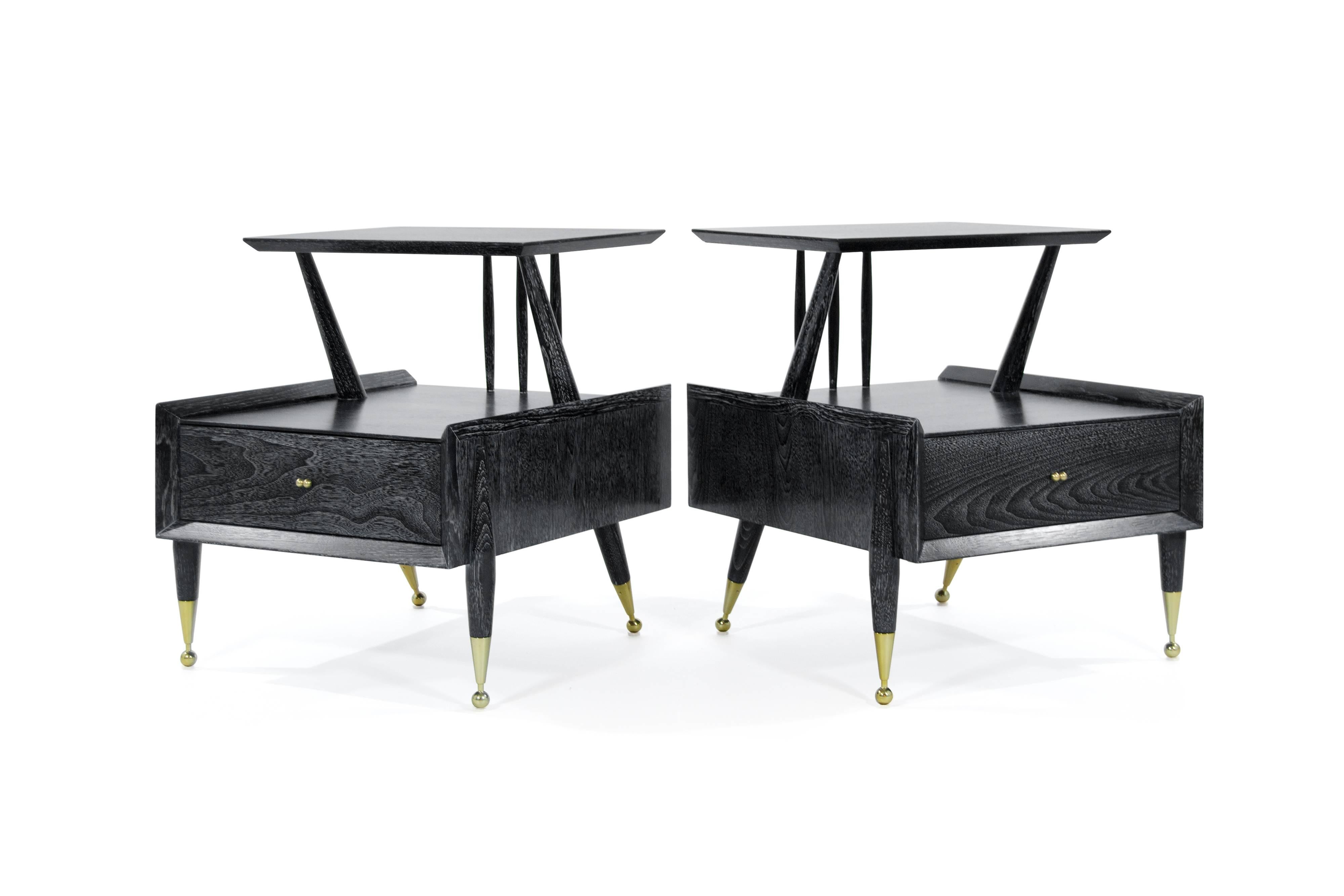 Pair of end tables or nightstands by Kent Coffey, newly refinished in black cerused. Brass hardware newly polished.