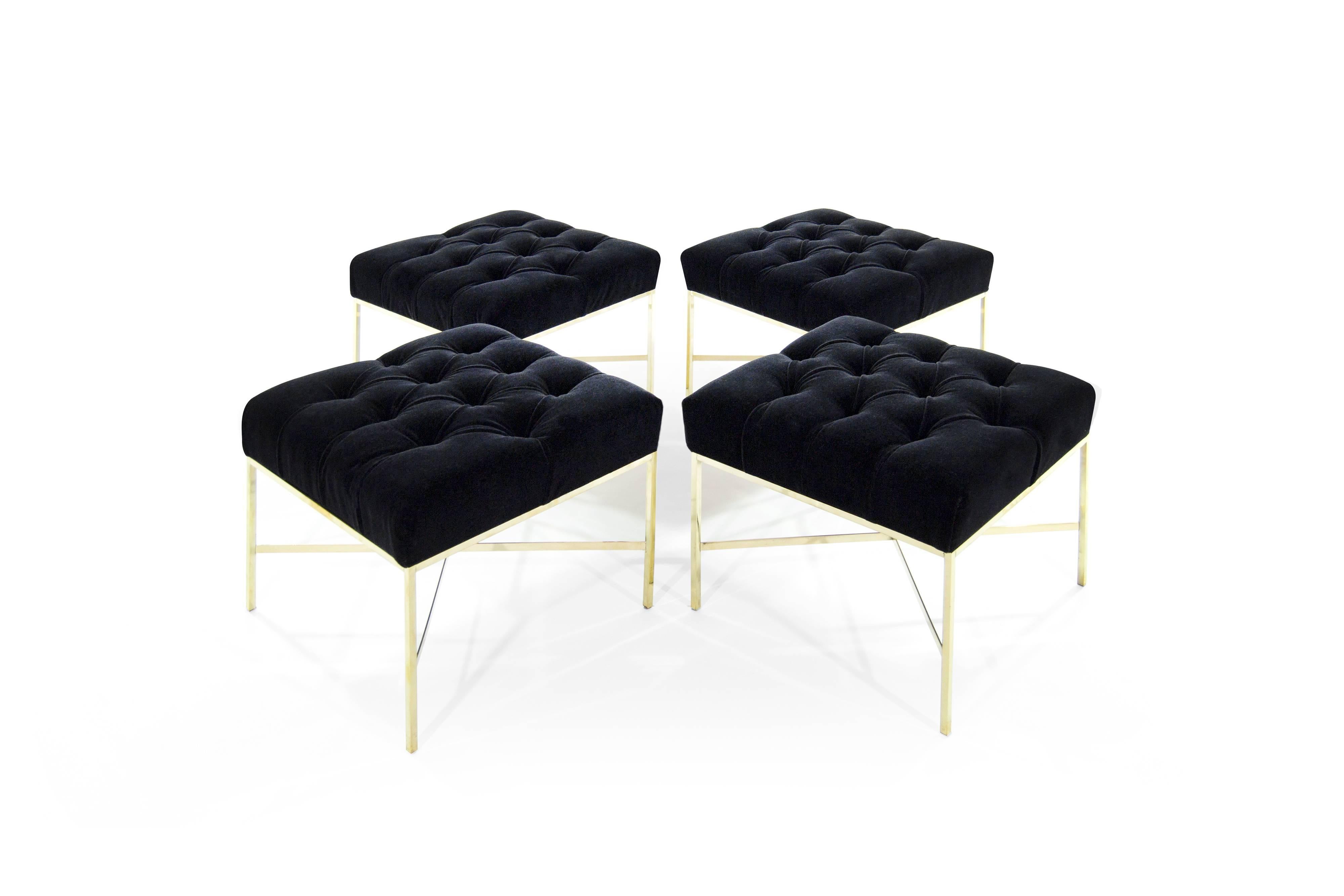 Set of four brass stools designed by Paul McCobb for Directional.

Newly upholstered in black mohair with a deep tufted detail. Priced individually.