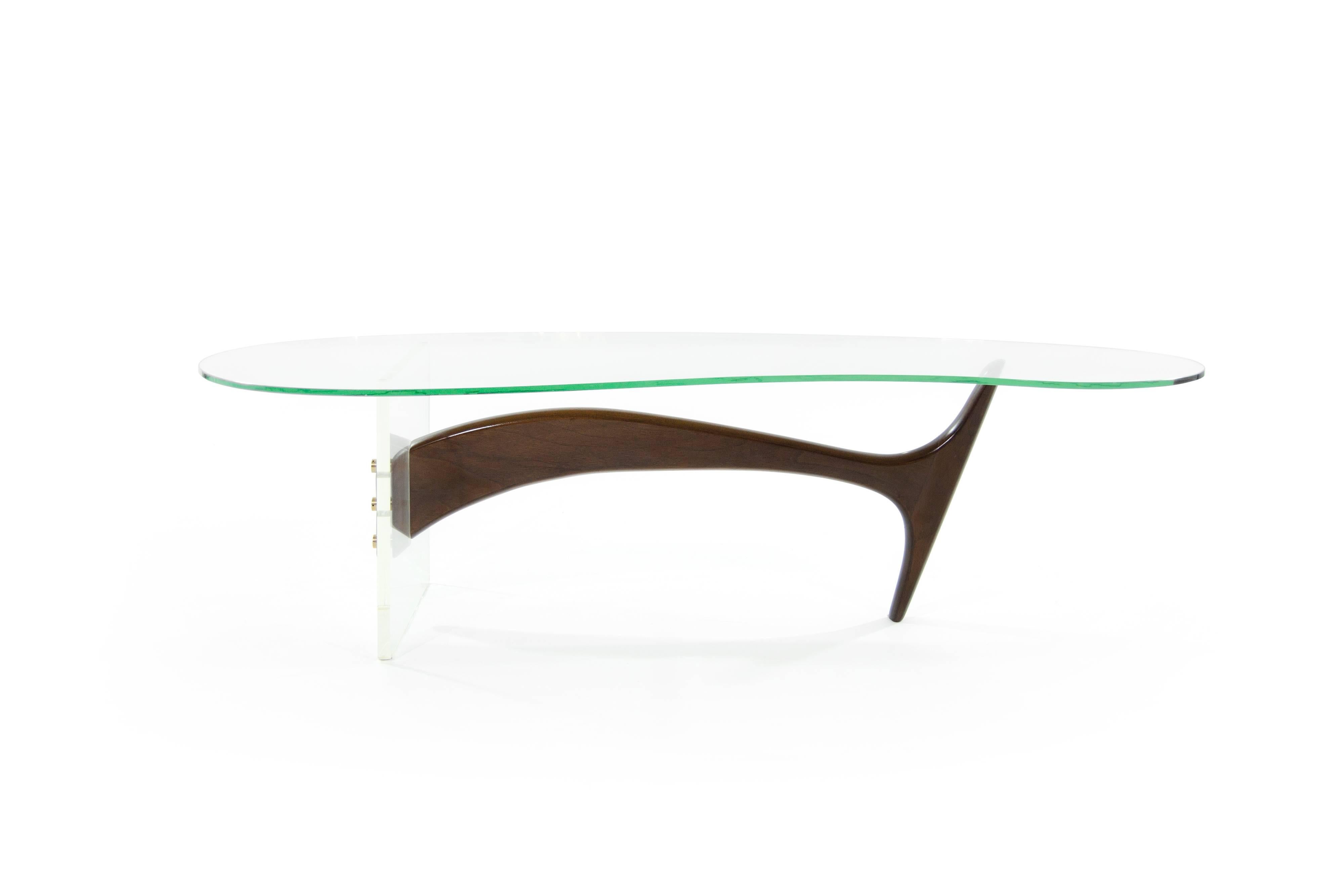 A phenomenal sculptural coffee table featuring a biomorphic 