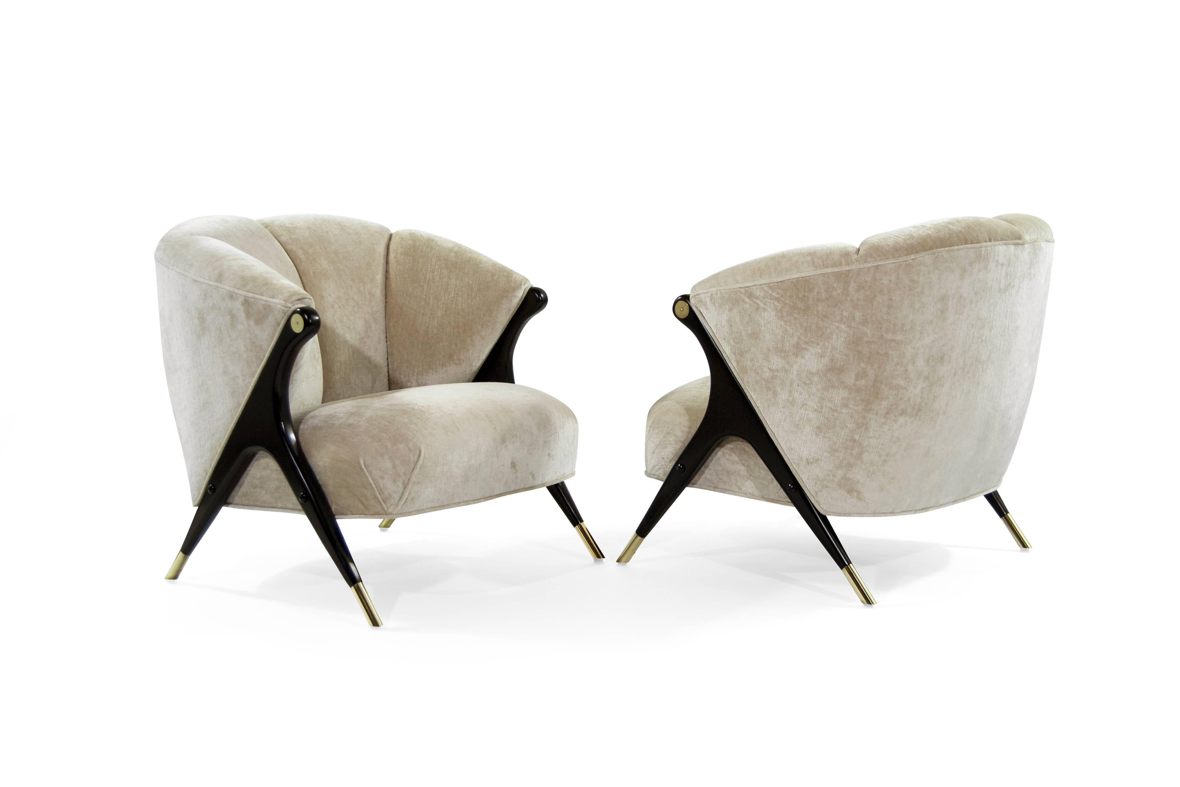 Stunning and rare pair of lounge chair by Karpen of California, circa 1950s.

Newly upholstered in beige chenille, sculptural walnut legs newly restored to their original ebony finish, brass newly polished.