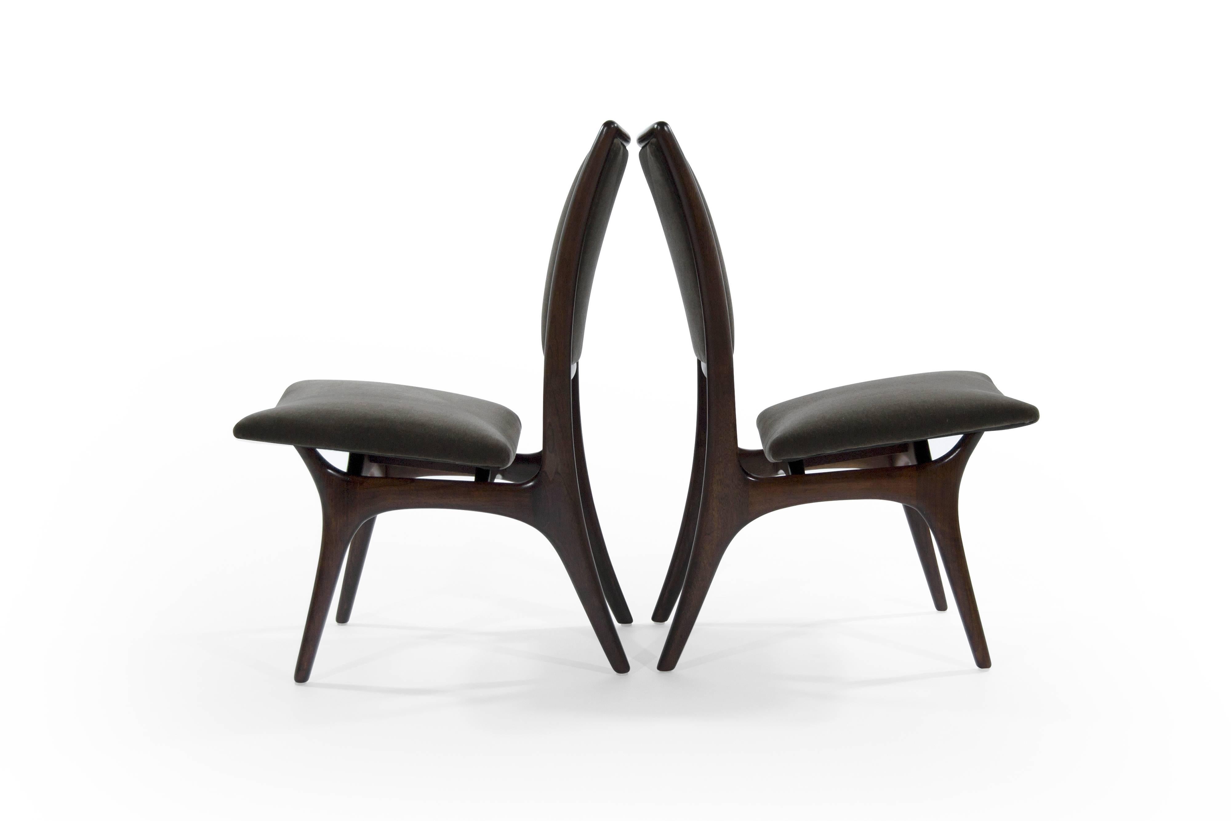 Pair of sculptural walnut side or desk chairs designed by Vladimir Kagan for Kagan Dreyfuss newly upholstered in charcoal mohair. Walnut frames fully restored.

Priced individually.