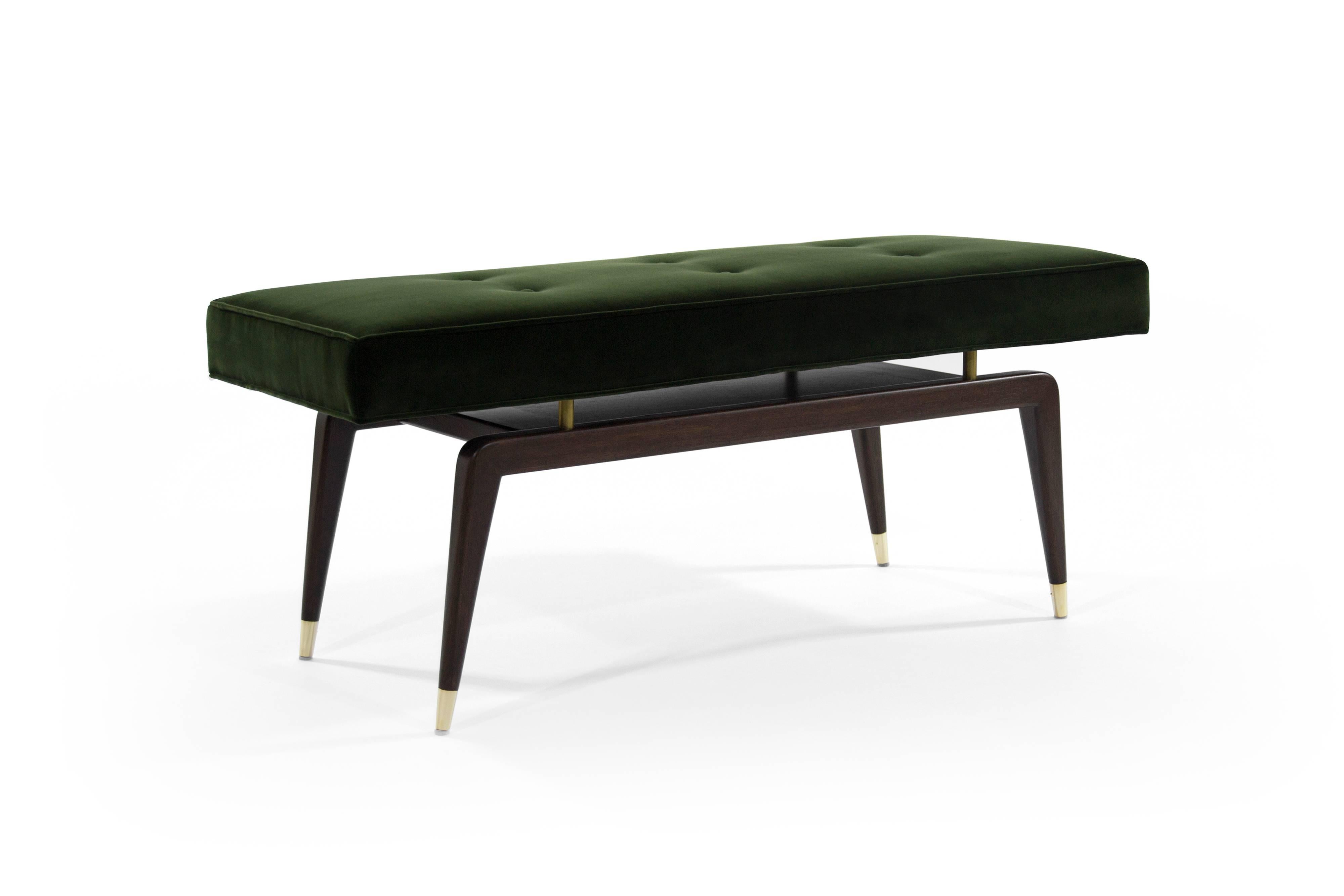 Mid-Century Modern bench in the style of Gio Ponti featuring newly polished brass risers and sabots. Walnut base fully restored, newly upholstered in olive velvet.