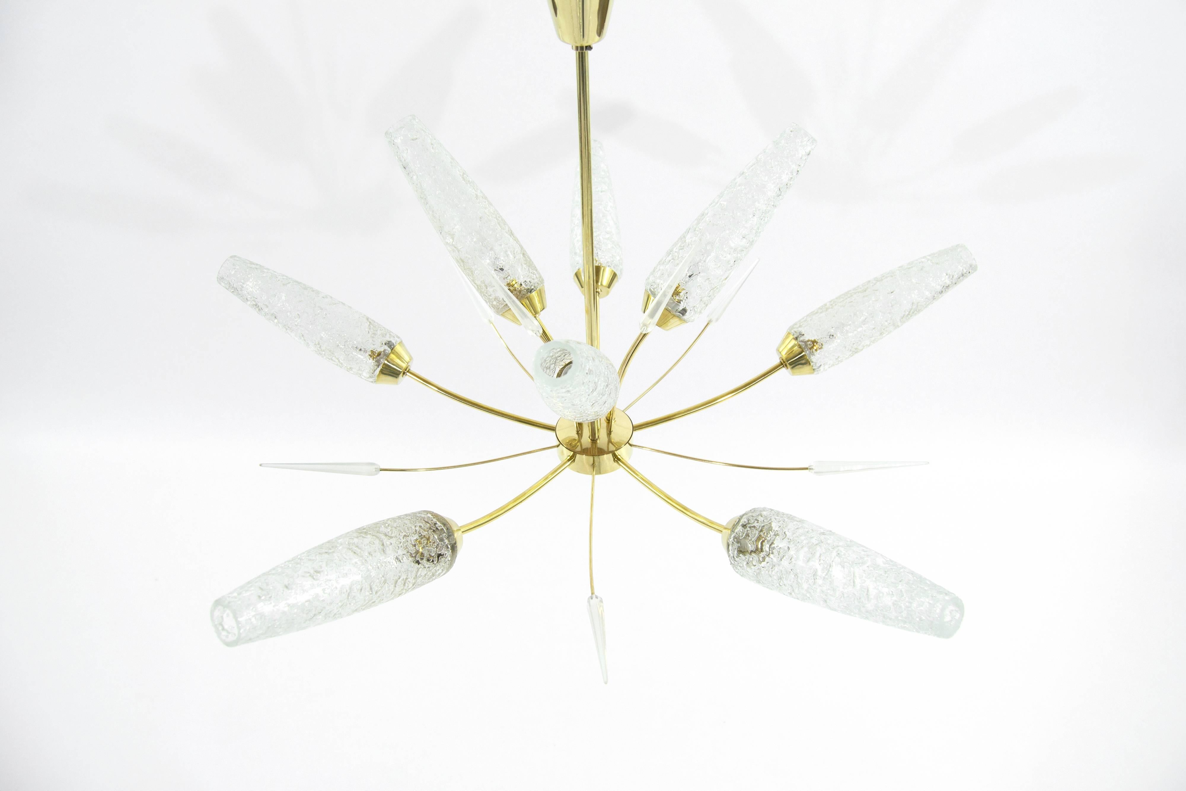 This exquisite sample of Italian lighting features seven arms ending in large Murano glass shades. Manufactured in Italy, circa 1950s. Newly polished and rewired.

Current drop is 21", however, adjustable.