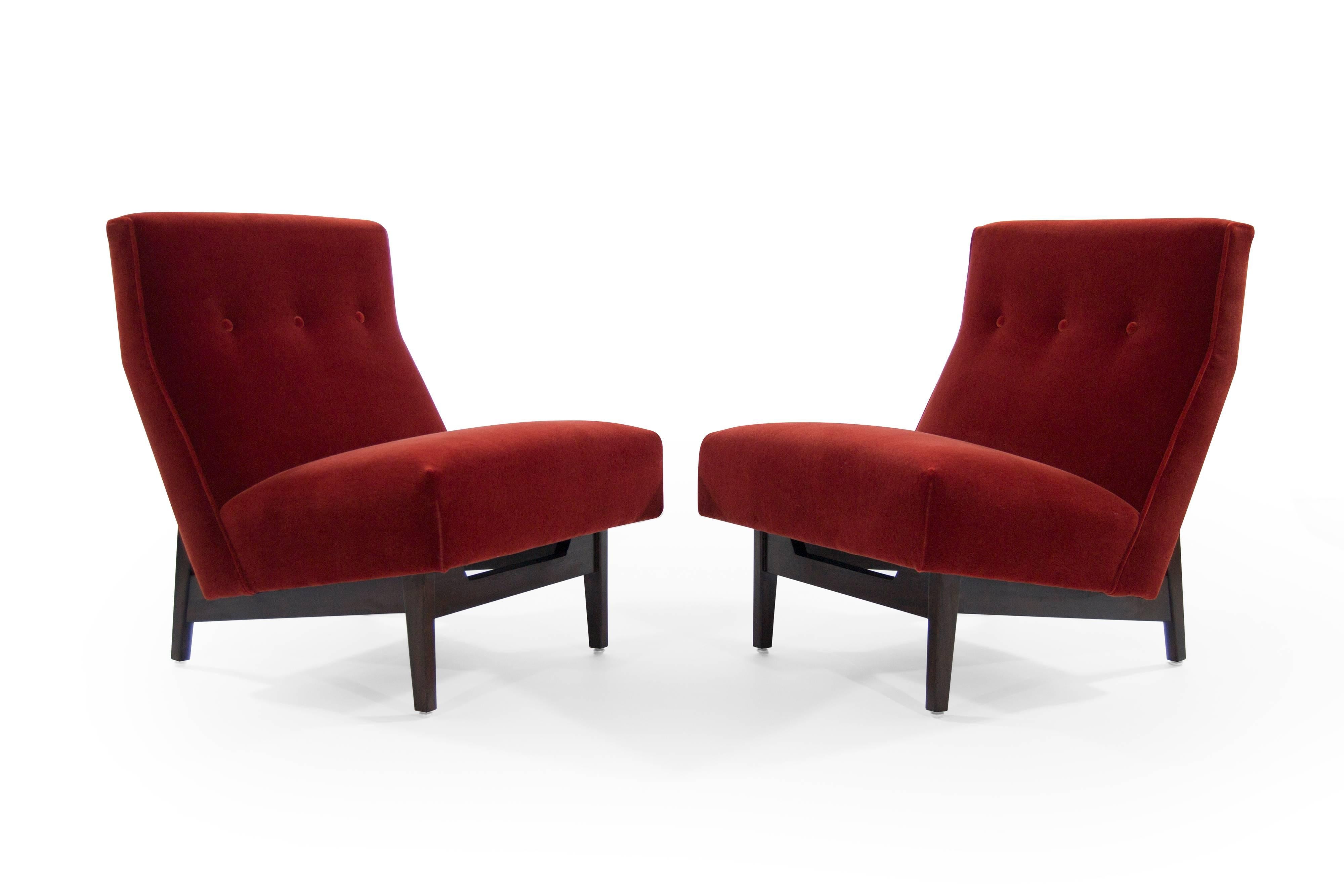 Pair of Jens Risom slipper chairs by Jens Risom, Inc. Walnut bases fully restored, newly upholstered in rust red mohair.