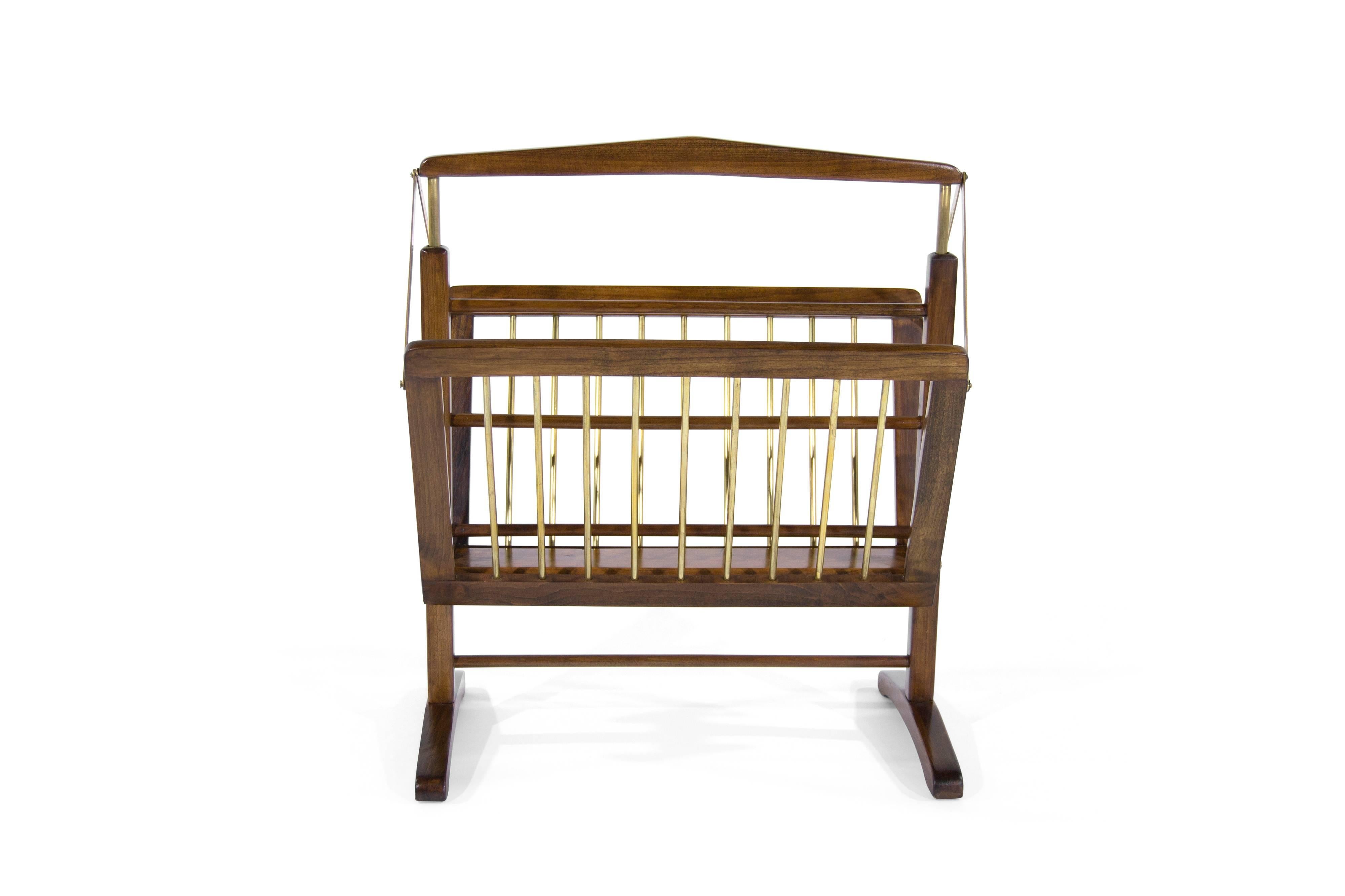 Sculptural walnut and brass magazine rack manufactured in Italy, circa 1950s. Fully restored.