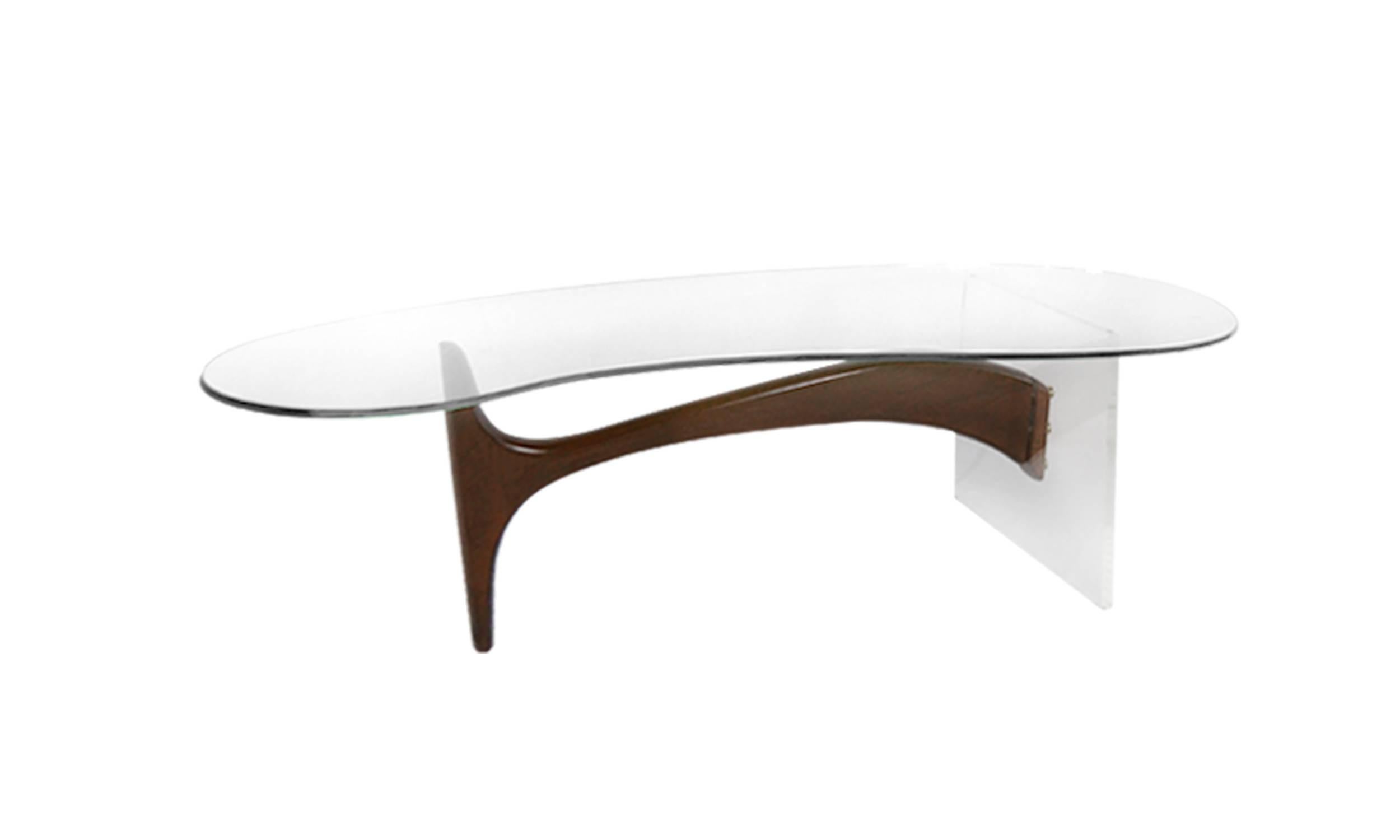 A phenomenal sculptural cocktail table featuring a biomorphic 