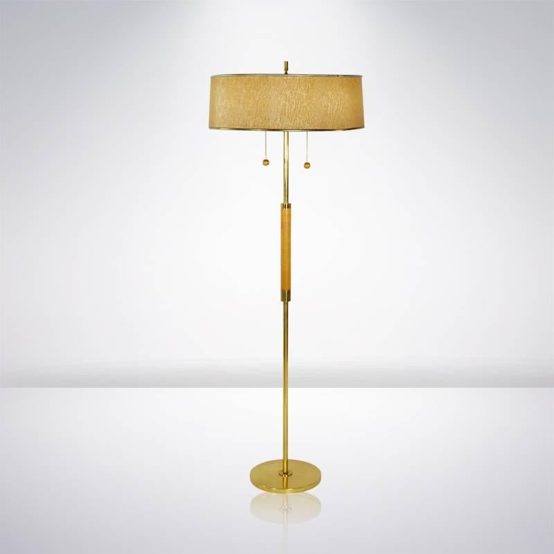 Mint condition 1950s brass and walnut floor lamp with original shade designed by Gerald Thurston for Lightolier. Newly rewired.