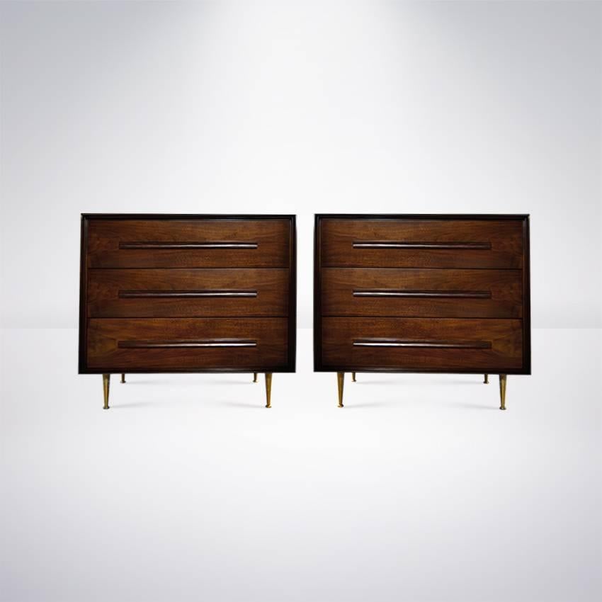 Exquisite pair of walnut chest of drawers by T.H. Robsjohn-Gibbings for Widdicomb, USA, circa 1950s. 

Walnut has been restored to its original finish allowing for the wood grain to present beautifully.
