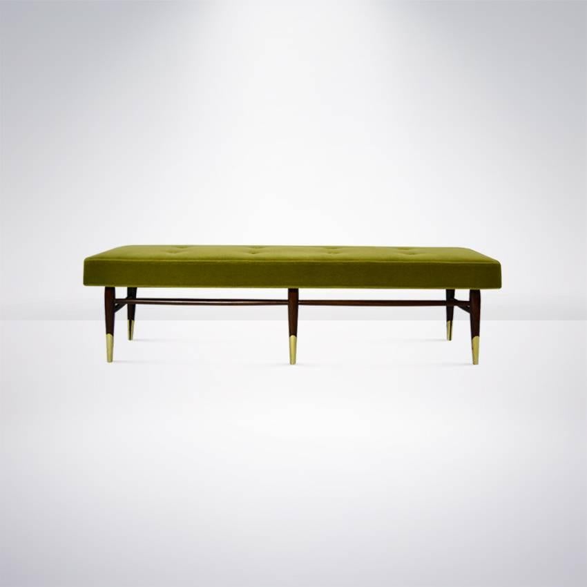 A beautiful bench newly upholstered in chartreuse mohair. Walnut base finished in medium walnut. Brass details have been hand polished.