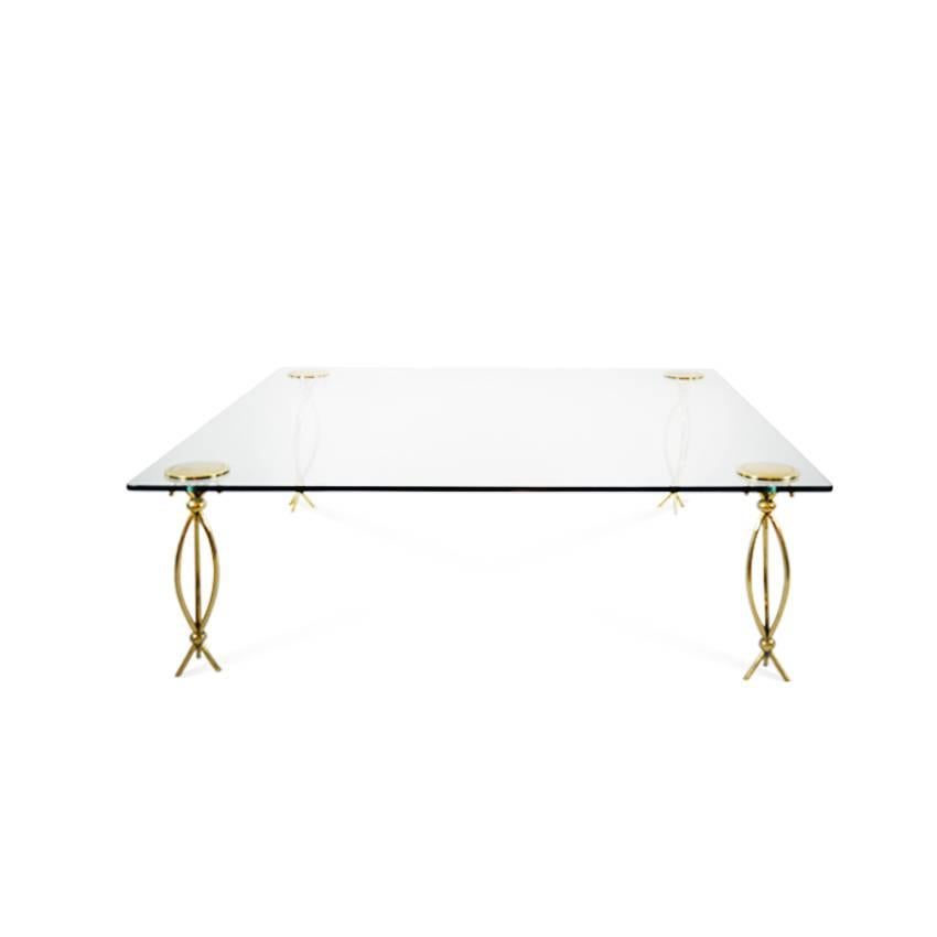 Sculptural brass legs support a 48" square glass top, fastened in place by brass discs. An exquisite example of Mid-Century, Italian design.