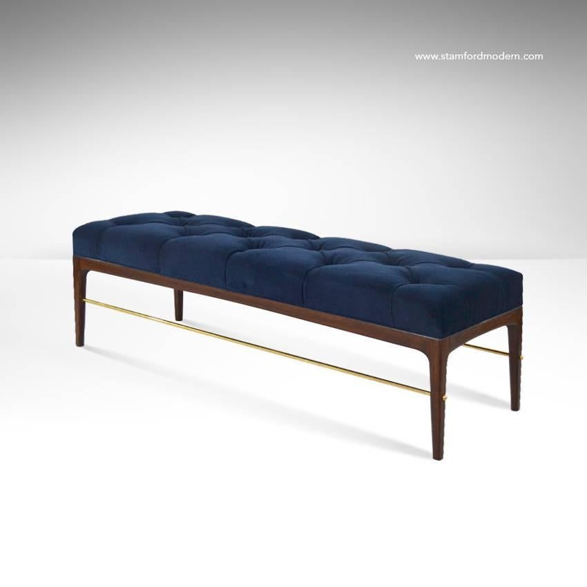 Stunning Mid-Century Modern walnut bench, upholstered in navy blue velvet. Newly fitted with custom brass rods.

In the style of: Paul McCobb, Edward Wormley, Dunbar, Directional, Milo Baughman, T.H. Robsjohn-Gibbings.