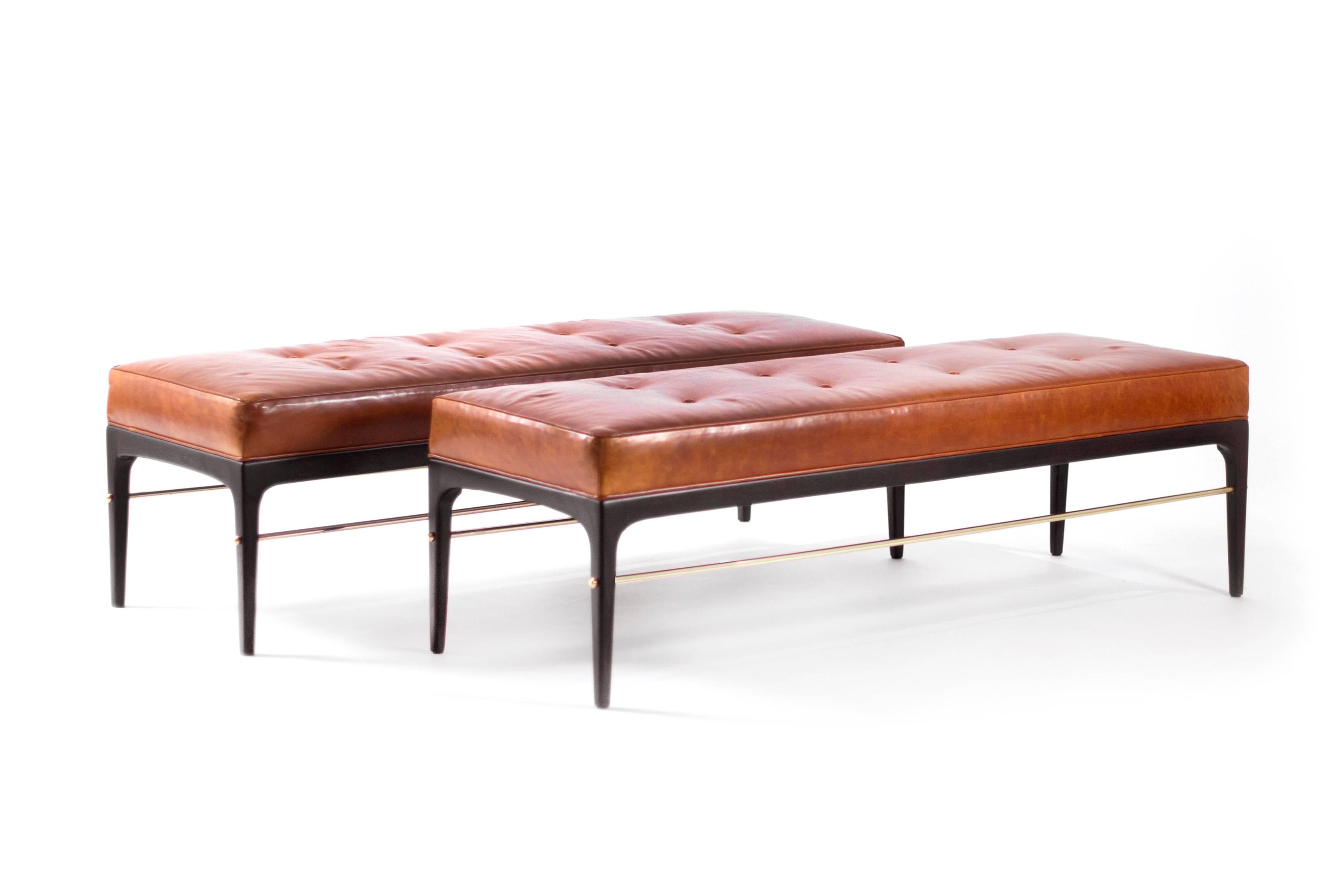 Stunning bench in the style of Edward Wormley for Dunbar. Newly fitted with brass rods, upholstered in cognac leather. Listing is for single bench.