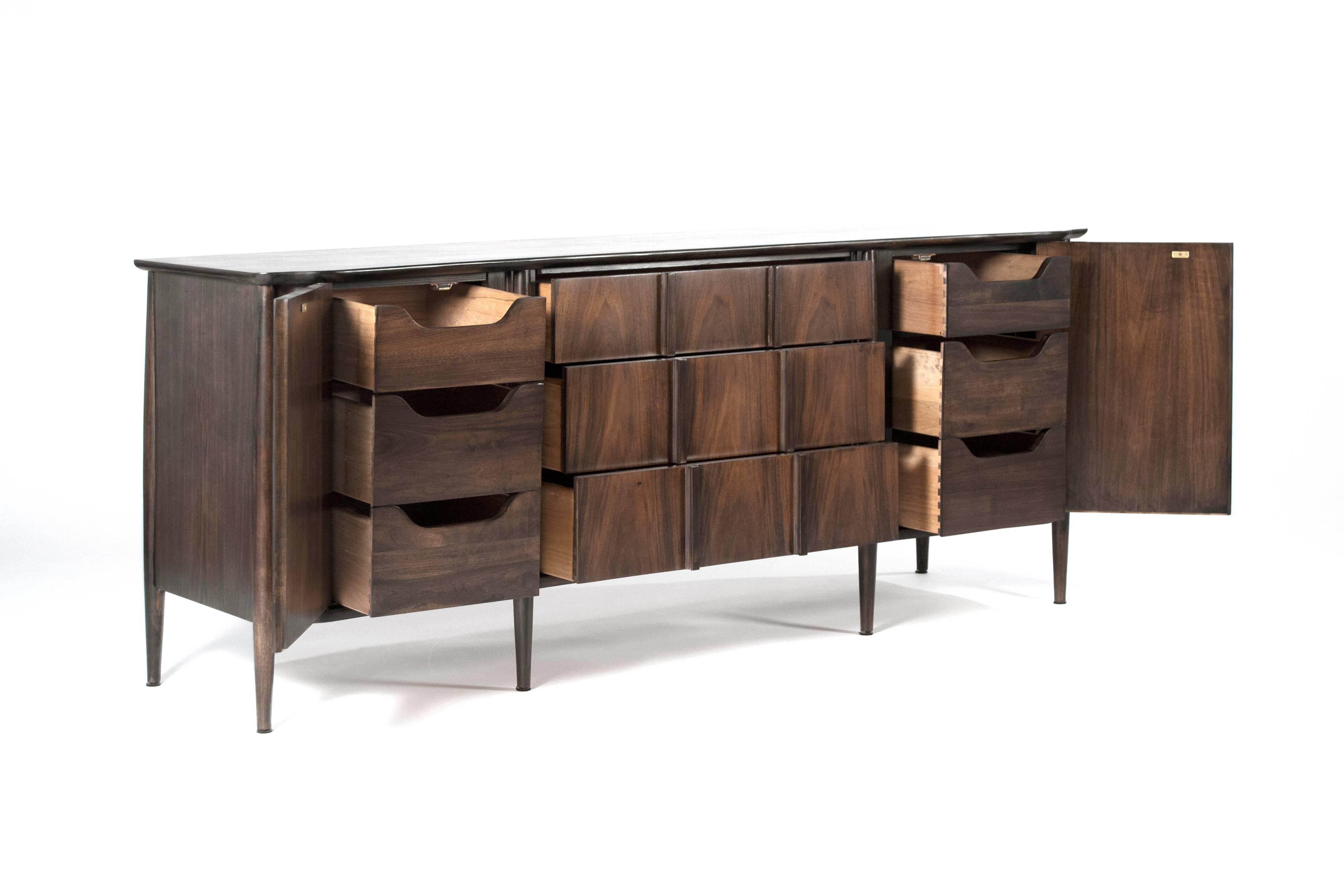 Fully restored, sculptural form walnut credenza in the style of Bertha Schaefer for M. Singer & Sons, circa 1950s.