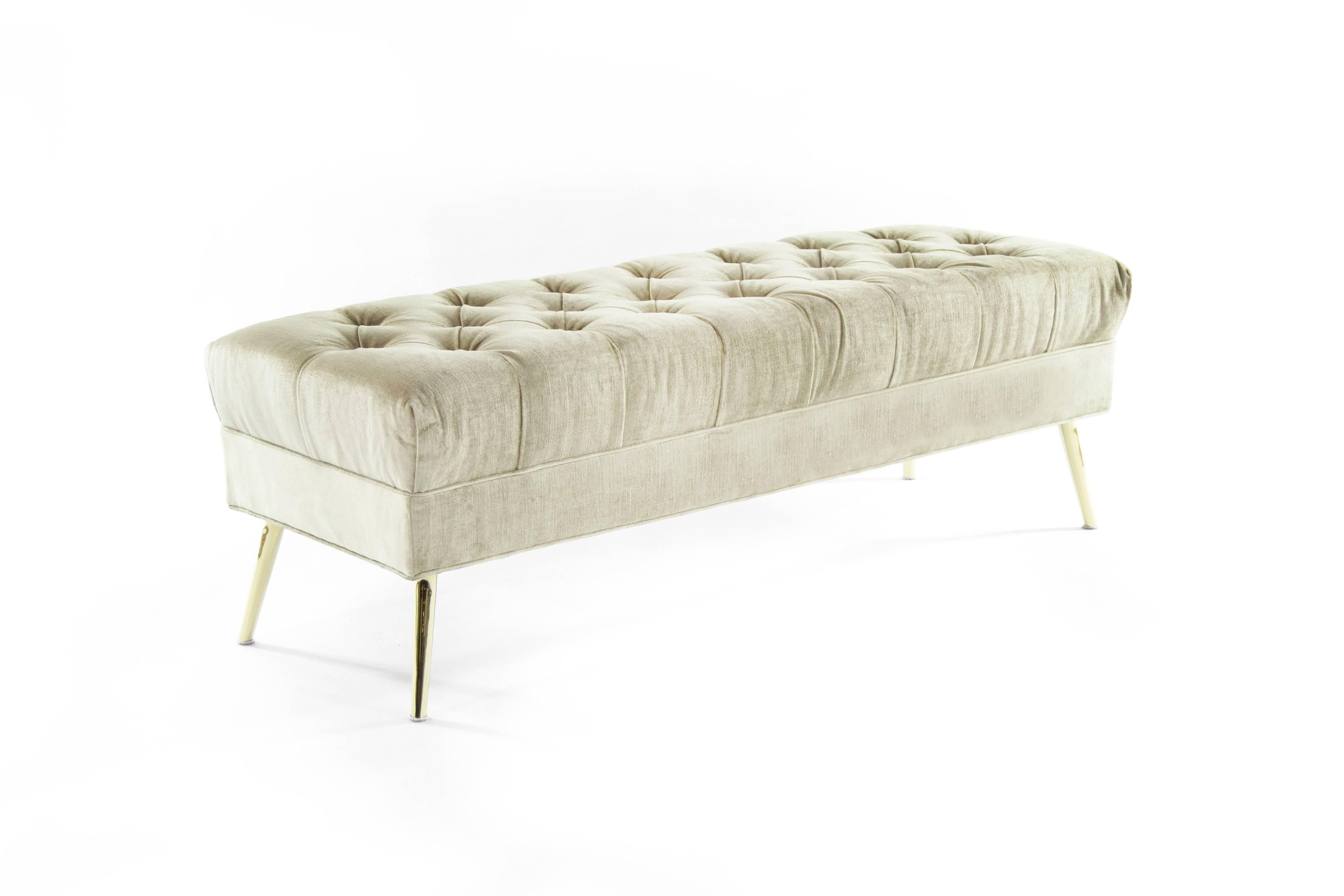 Stylish 1950s tufted bench, newly upholstered in shiny beige velvet. Brass legs newly polished.