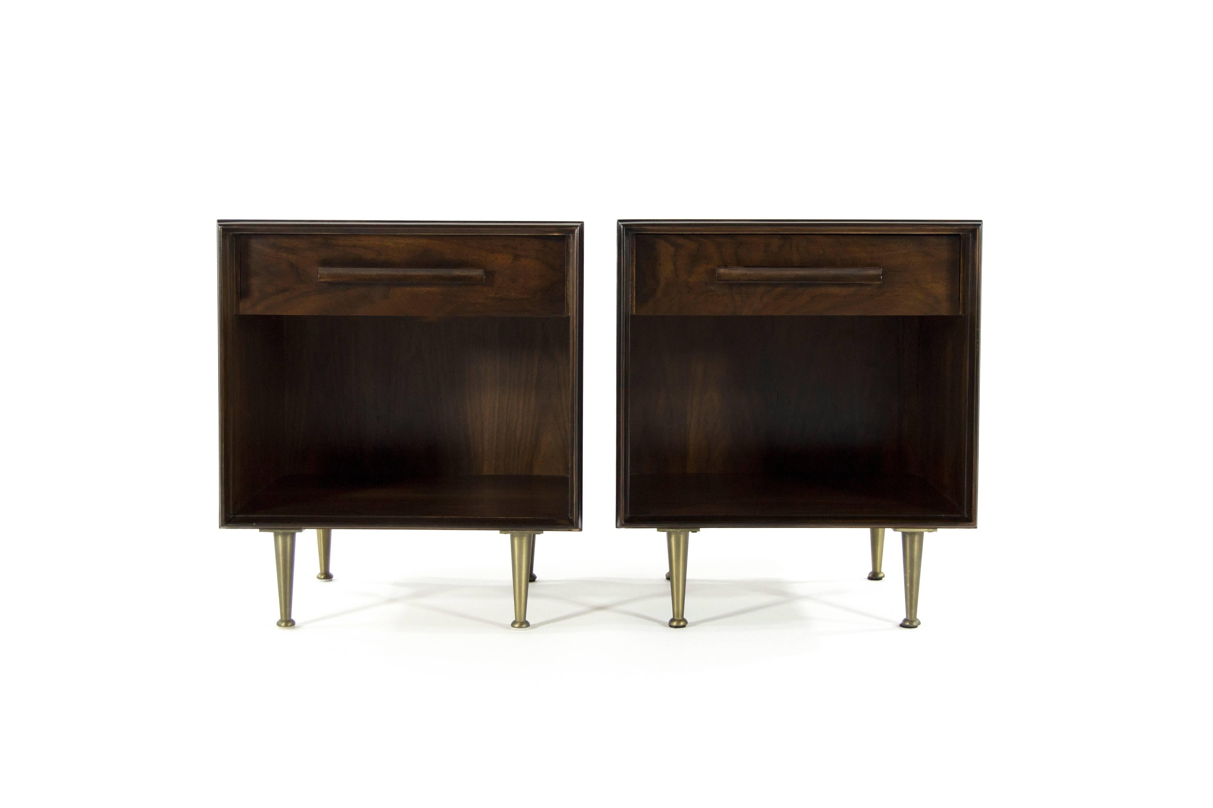 Exquisite pair of walnut nightstands or end tables by T.H. Robsjohn-Gibbings for Widdicomb, circa 1958.

Walnut has been restored to its original finish allowing for the wood grain to present beautifully. Original brushed brass legs in excellent