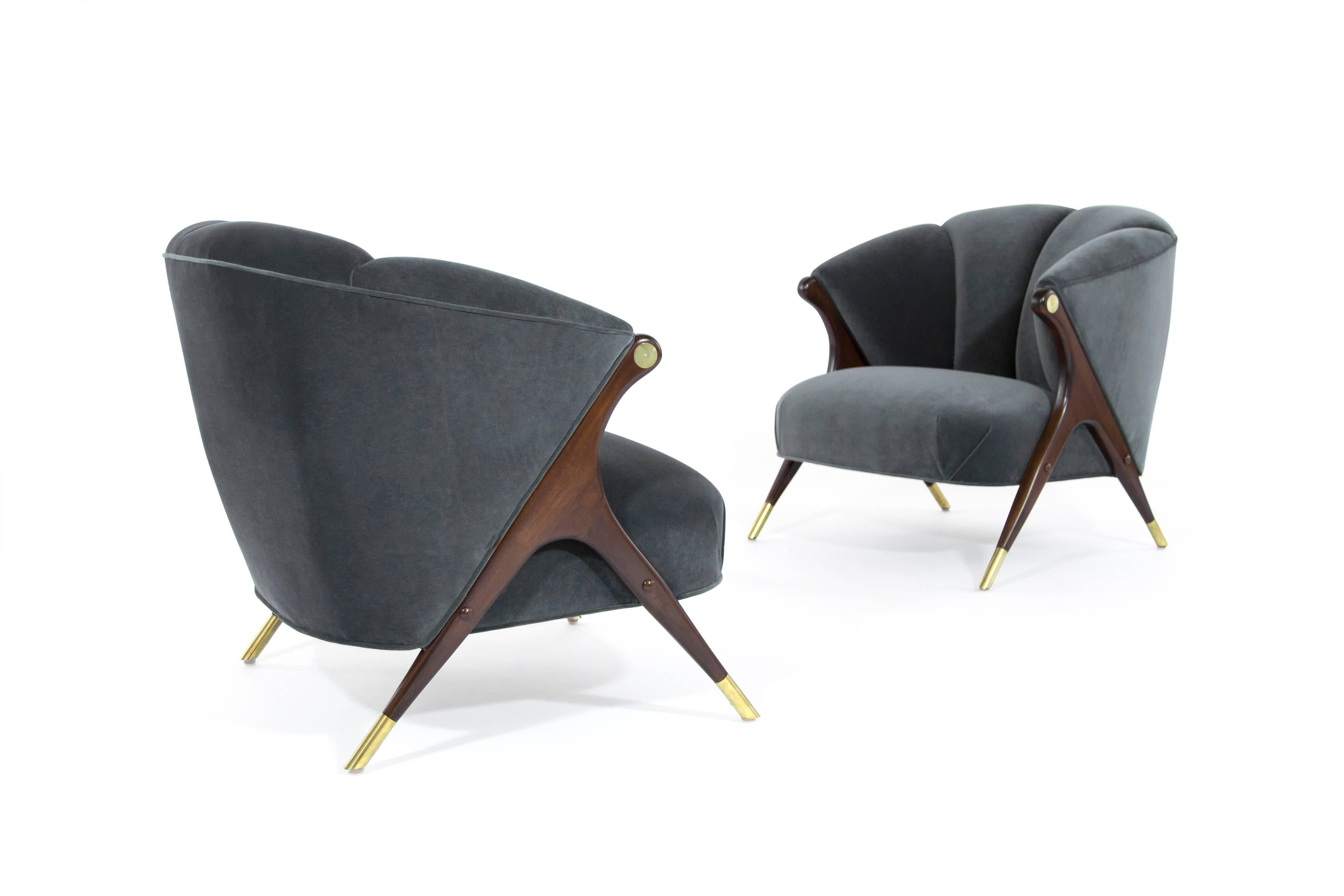 Stunning and rare pair of lounge chair by Karpen of California, circa 1950s.

Newly upholstered in granite velvet, sculptural walnut legs newly restored to their original medium walnut finish, brass newly polished.
  