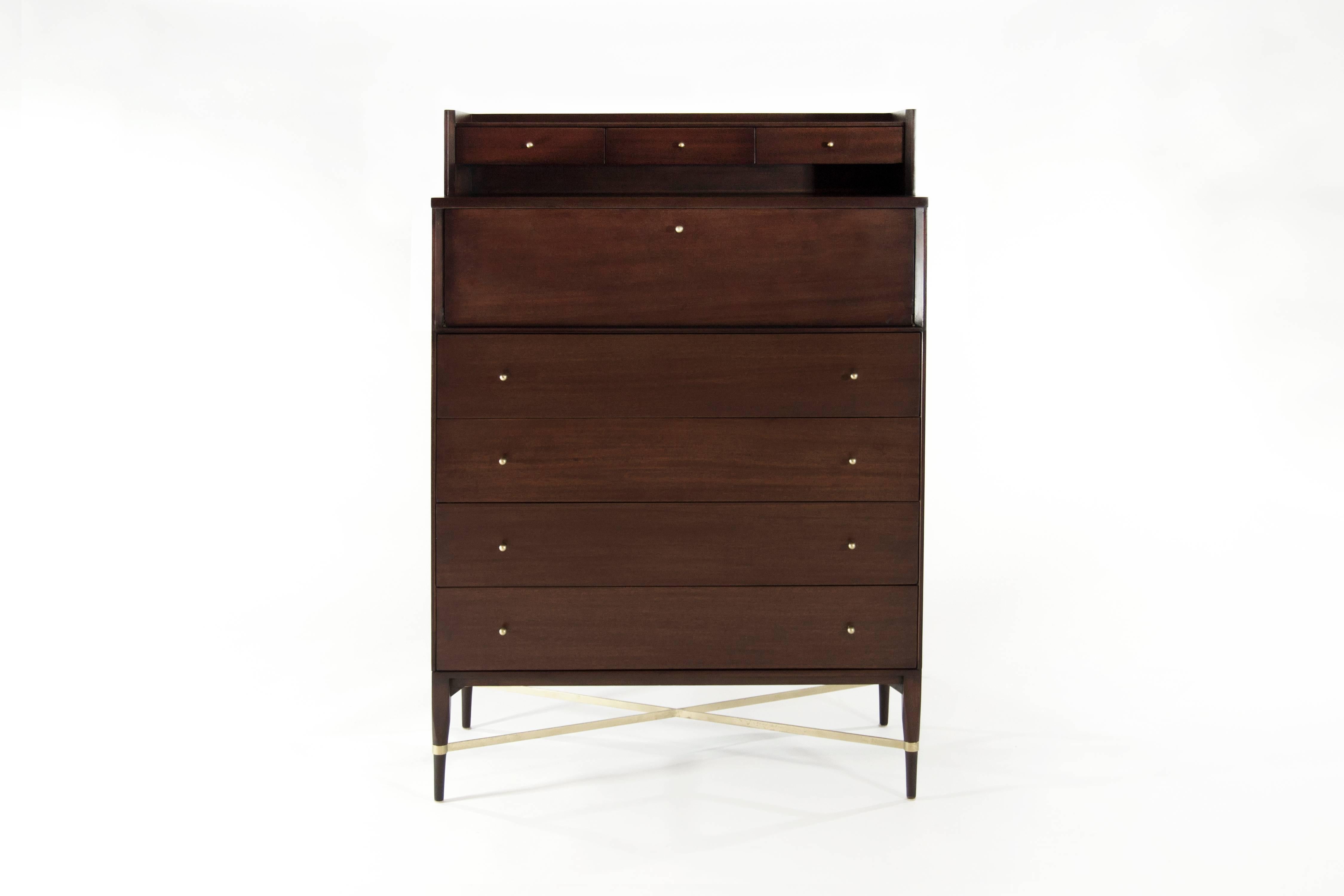 In our opinion one of Paul McCobb's most handsome and desirable designs Fully restored rare model 1013 gentleman's chest of drawers or dresser from the Calvin group. Elegant and stately, it is loaded with refined details. A bank of three shallow