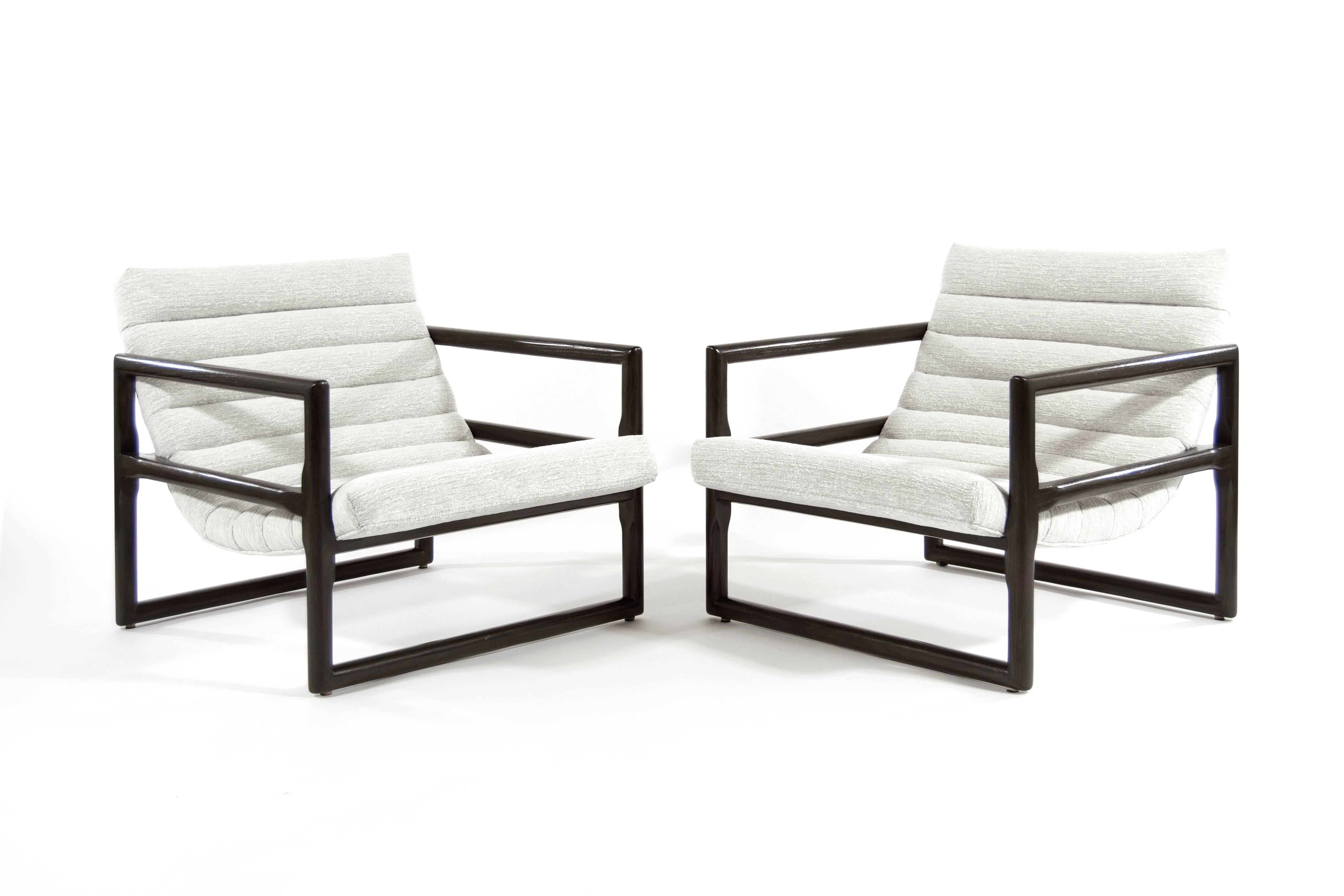 Stylish channelled lounges designed by Milo Baughman for Thayer Coggin. Solid oak frames have been newly refinished. Newly upholstered in grey chenille.