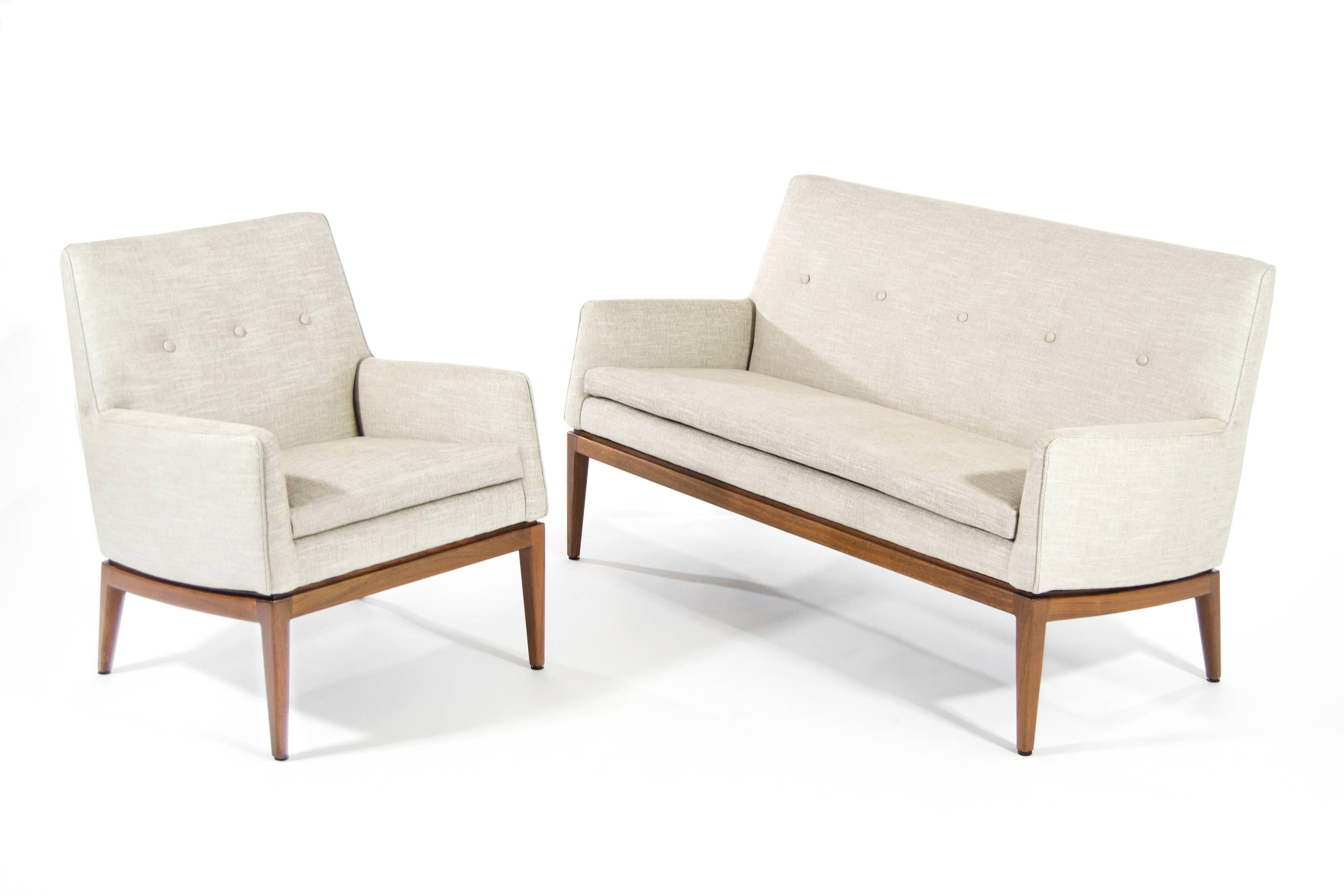 Loveseat and lounge chair by Jens Risom for Jens Risom design. Newly upholstered in linen, walnut bases fully restored.

Priced as set but also available individually. 

Chair dimensions: Height 31