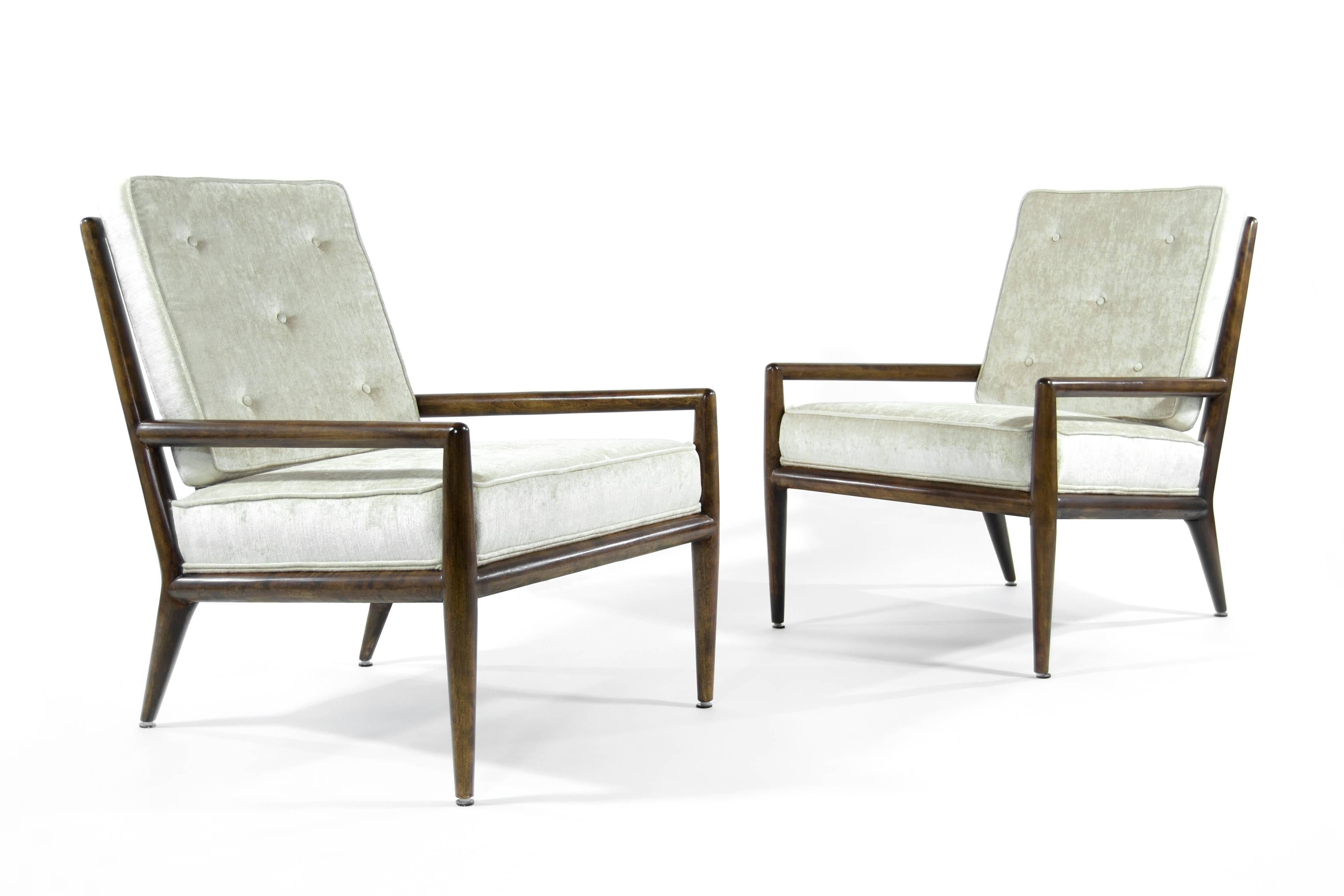 Lovely pair of Classic lounge chairs by T.H. Robsjohn-Gibbings for Widdicomb. Walnut fully restored. Newly upholstered in beige chenille.
