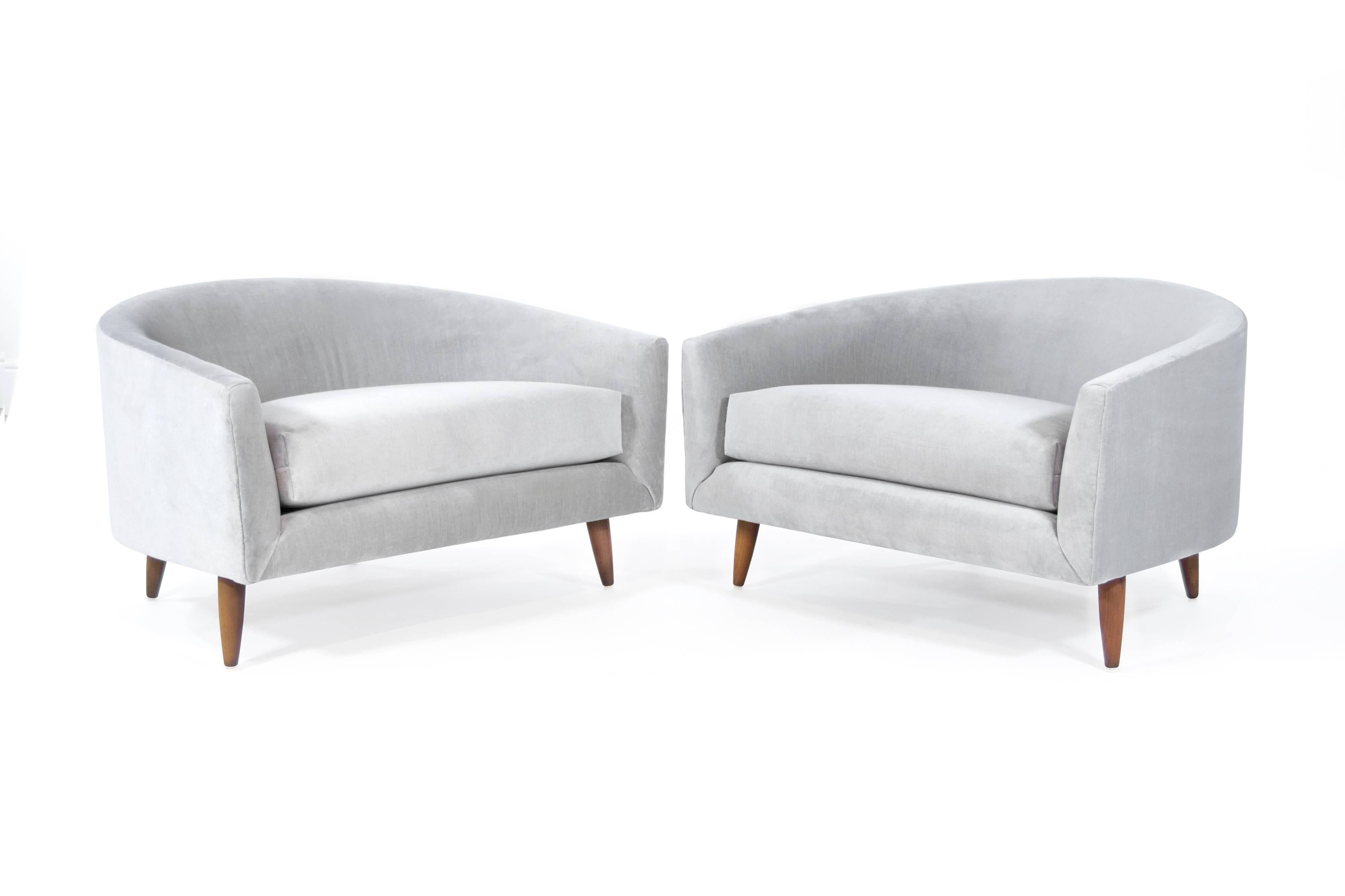Rare pair of low and wide profile, lounge chairs designed by Adrian Pearsall for Craft Associates. Extremely comfortable! Perhaps one of Adrian's best designs.

Newly upholstered in Cannes velvet cannon grey by JB Martin. Walnut legs fully