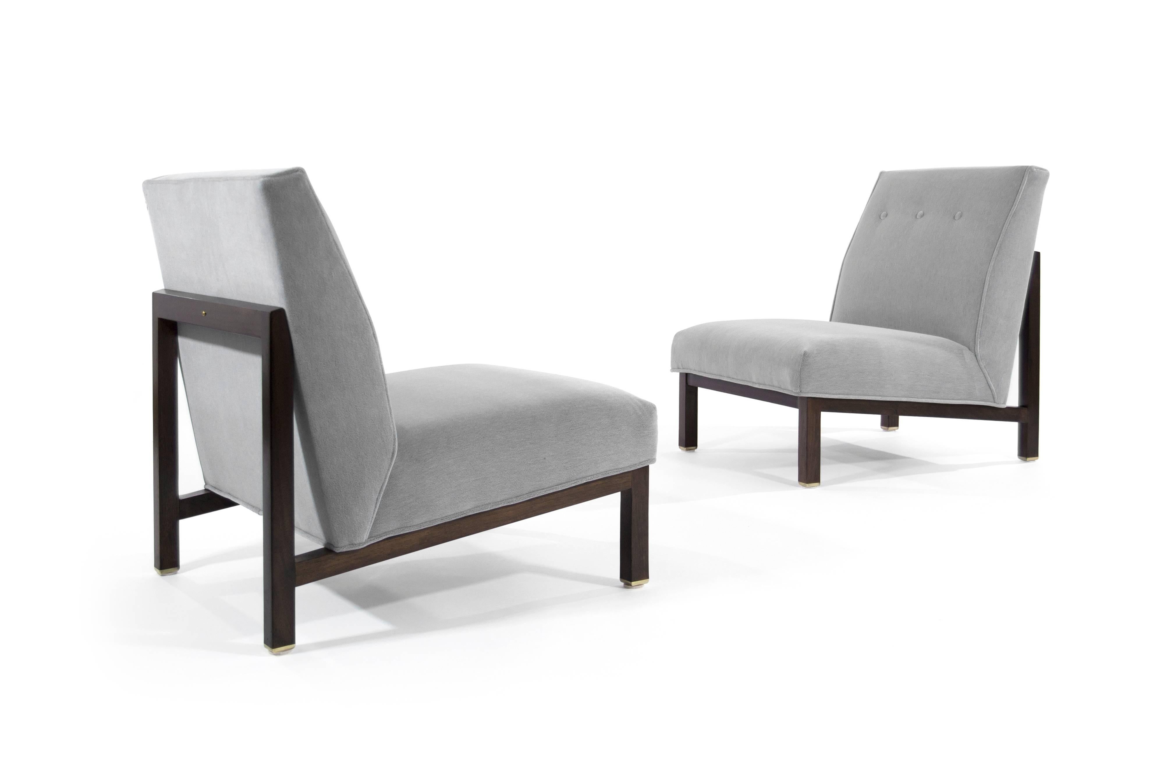 Pair of slipper chairs designed by Edward Wormley for Dunbar.
Walnut frames fully restored, brass feet hand polished, newly upholstered in grey mohair.