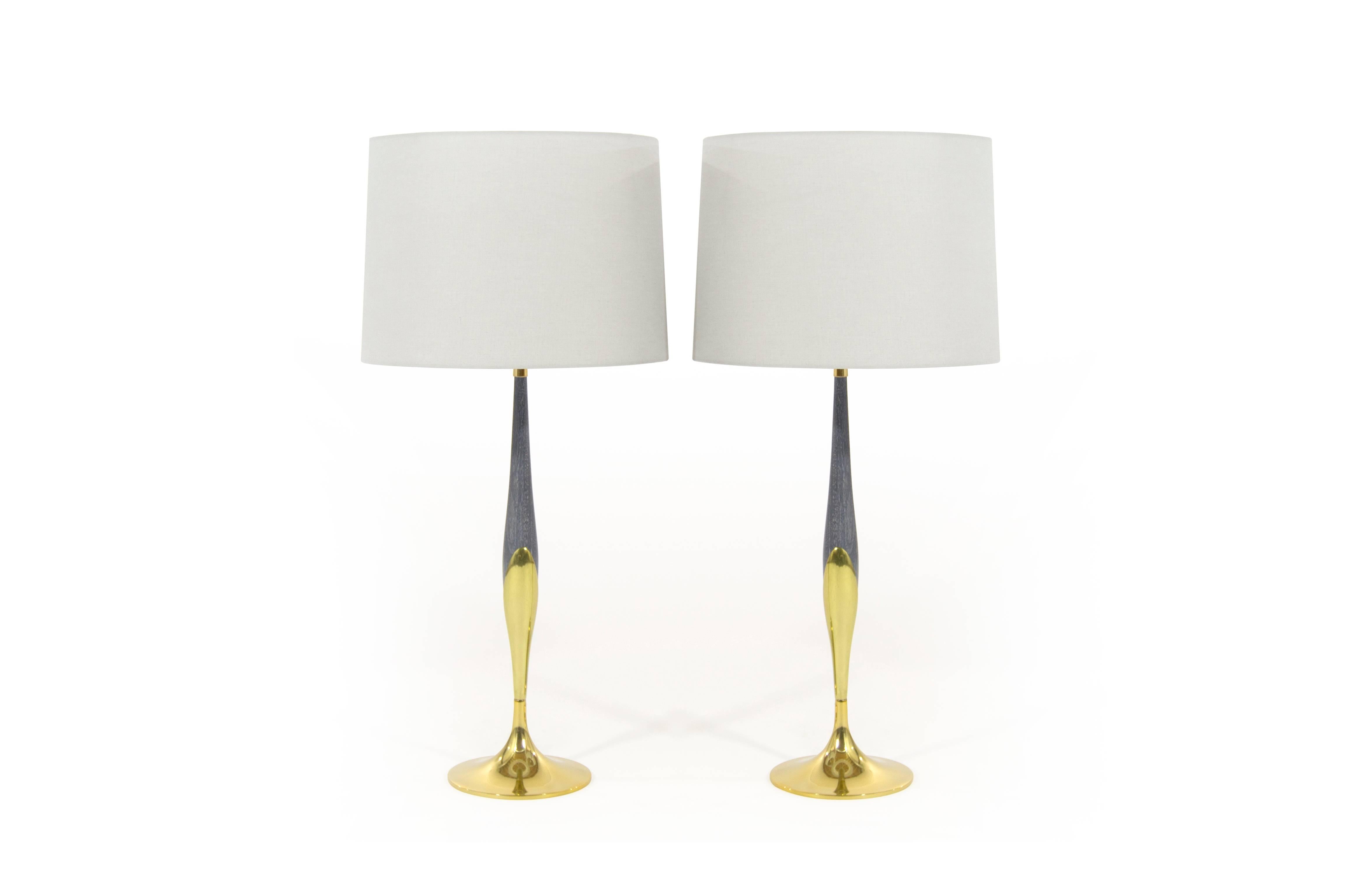 Pair of sculptural table lamps by Laurel, brass newly polished, wood newly redone in grey ceruse, complimented beautifully by light grey linen shades.
