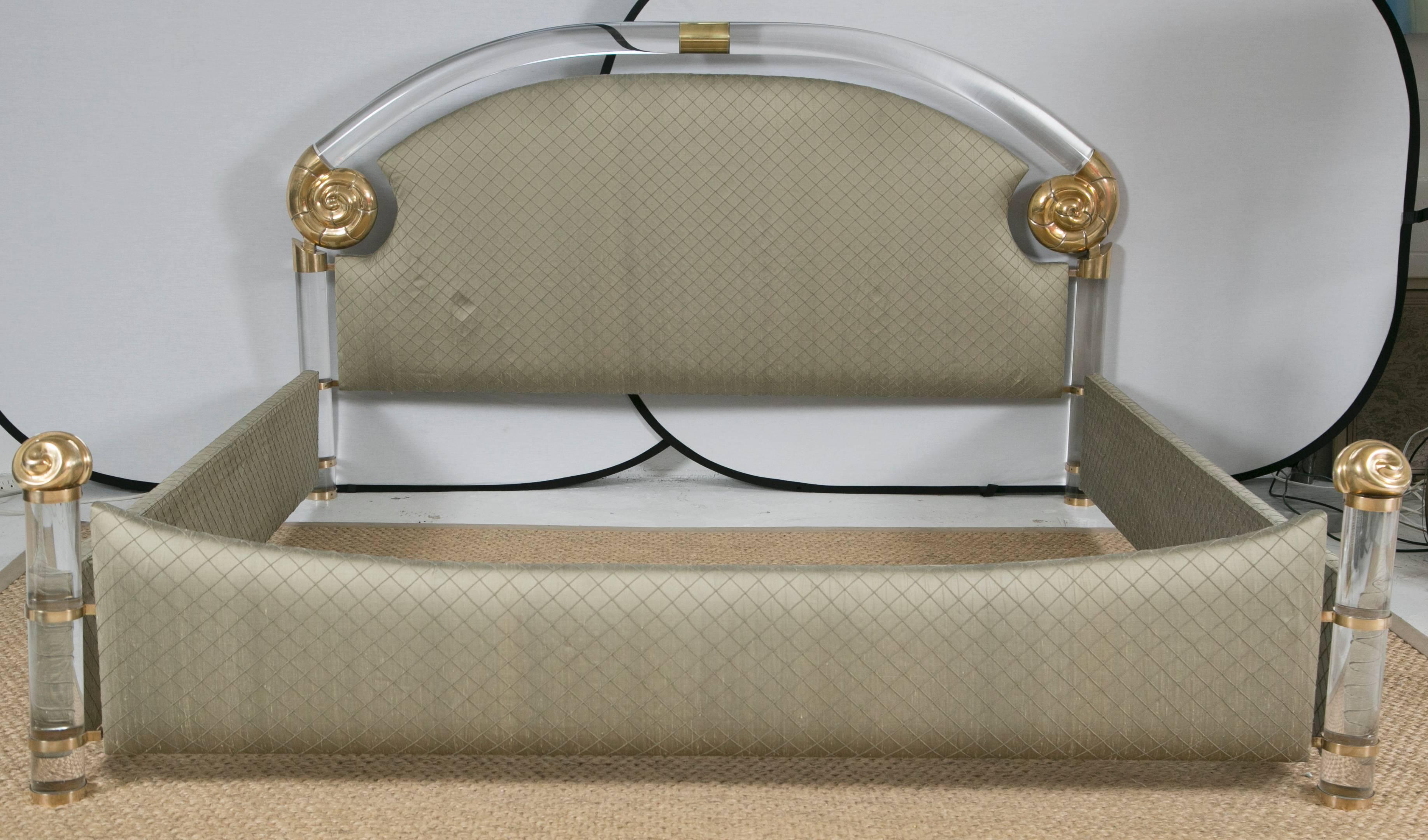Glamorous does not say it all for this fabulous piece designed by Marcello Mioni. Using some of the thickest and heaviest Lucite we've ever seen, the bed is crafted and joined together by solid brass shell motif accents. It is truly a rare site and
