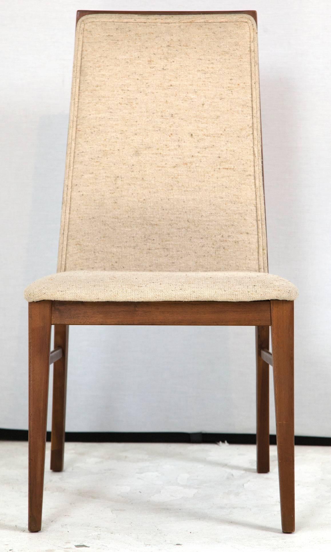 A handsome set of walnut dining chairs designed by Milo Baughman for Dillingham, currently in vintage upholstery. The lines on these are wonderfully architectural, clean and simple. These say Milo all over them! Priced as a vintage set of 4 and new