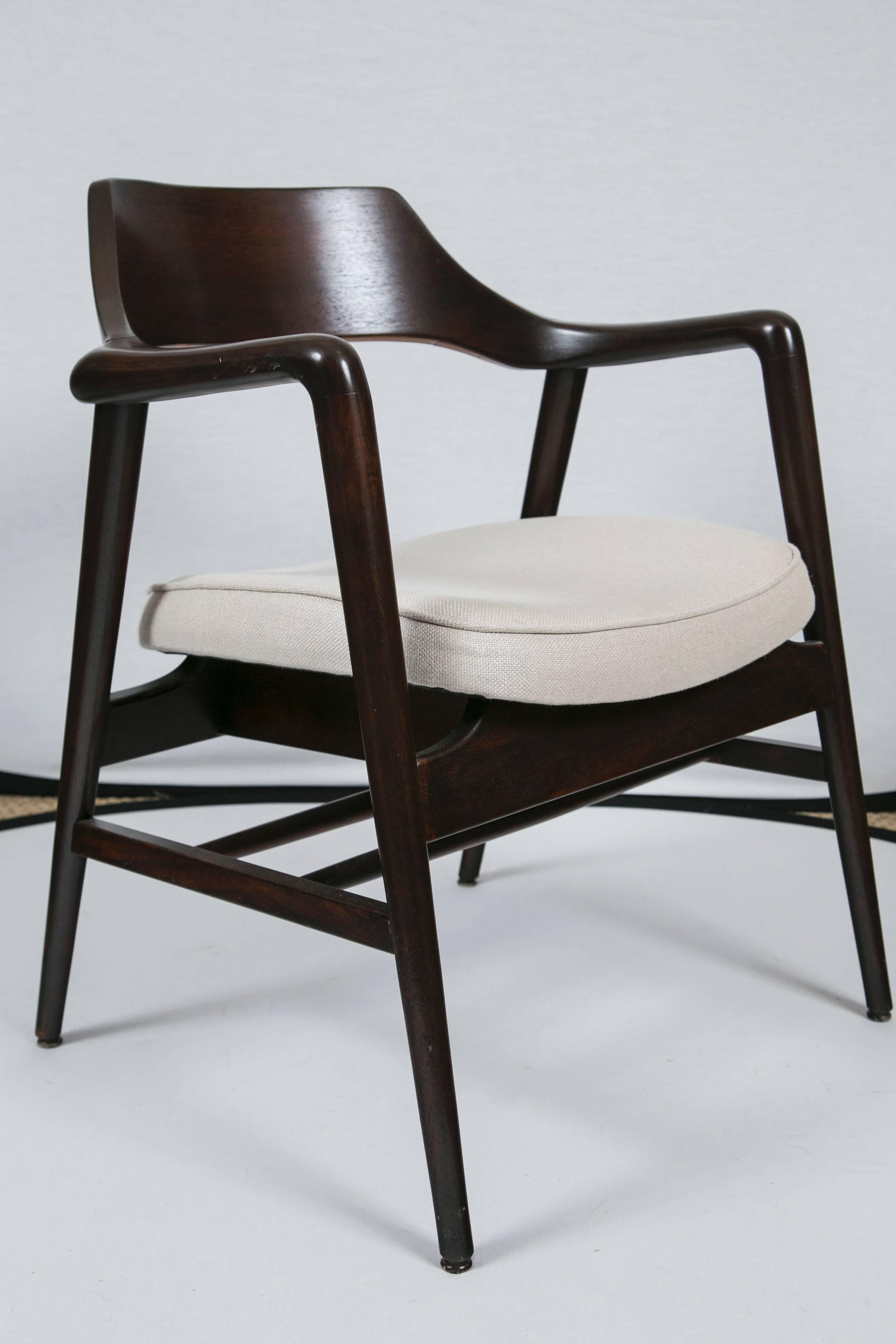 Richly inspired by Danish design, this American crafted Gunlocke armchair speaks volumes for quality and aesthetic. The walnut frame is newly refinished in a wonderful dark chocolate stain. We have also upholstered the seat with a high quality linen