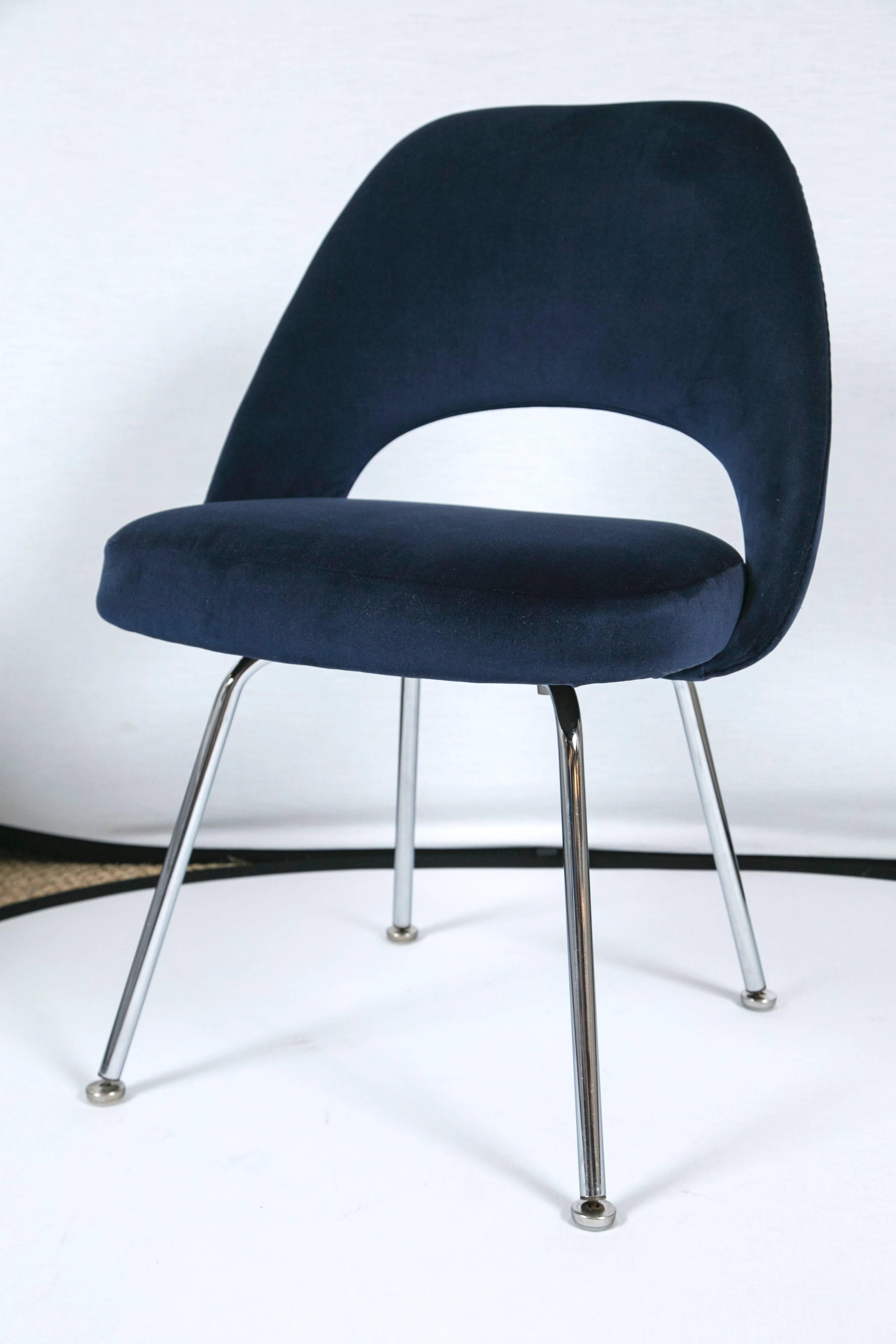 Mid-Century classic Eero Saarinen executive armless chairs, manufactured by Knoll Furniture. These are custom upholstered in a deep navy Italian velvet. We completely restore each chair in our own in-house workroom and in addition to new fabric we