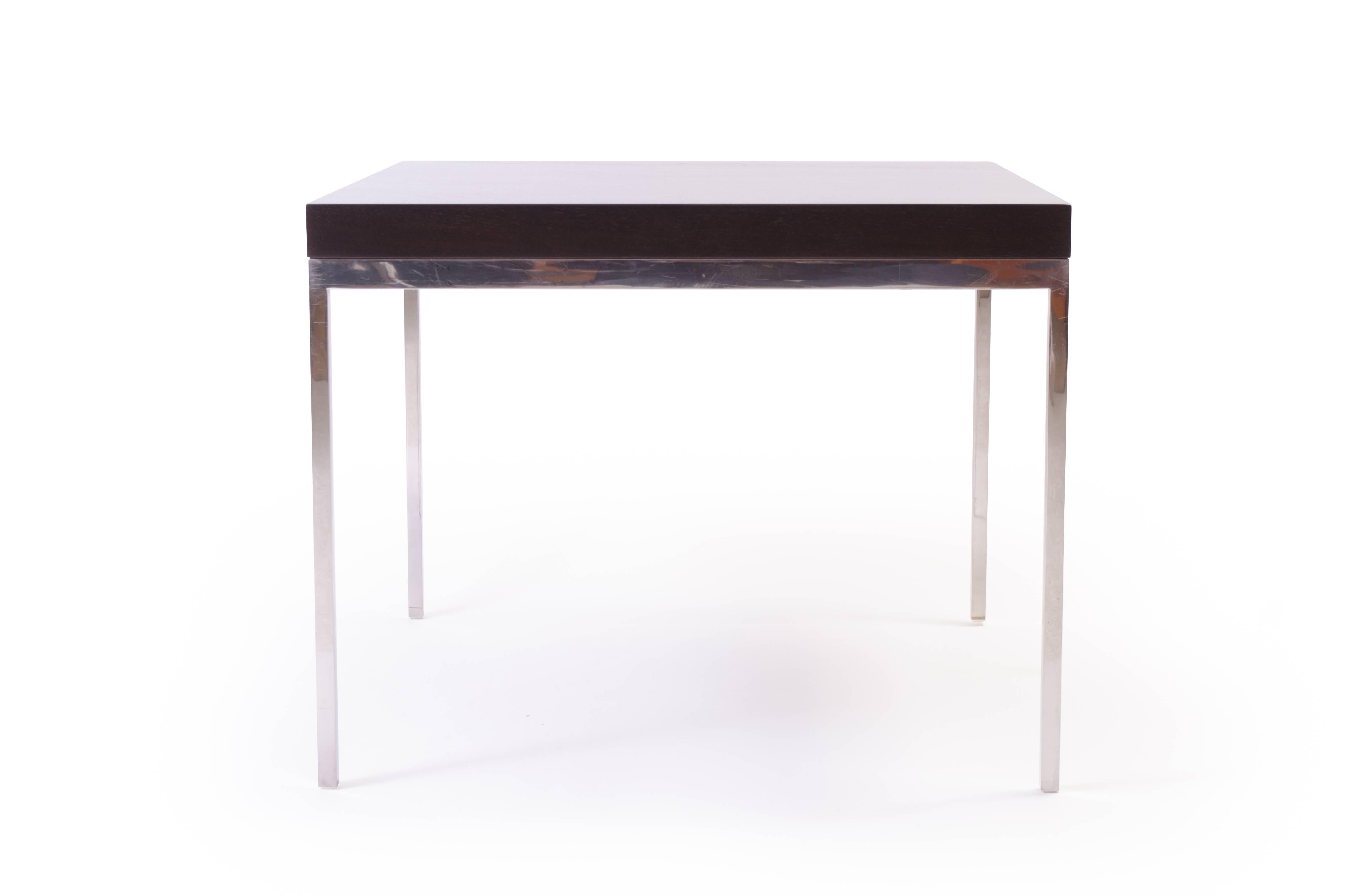 A powerful modernist design using the best materials. A solid plinth of walnut wood with a deep ebony stain mounted atop a sleek solid stainless steel frame. The piece is proportionally delicate and structurally heavy, incredible quality. Perfect
