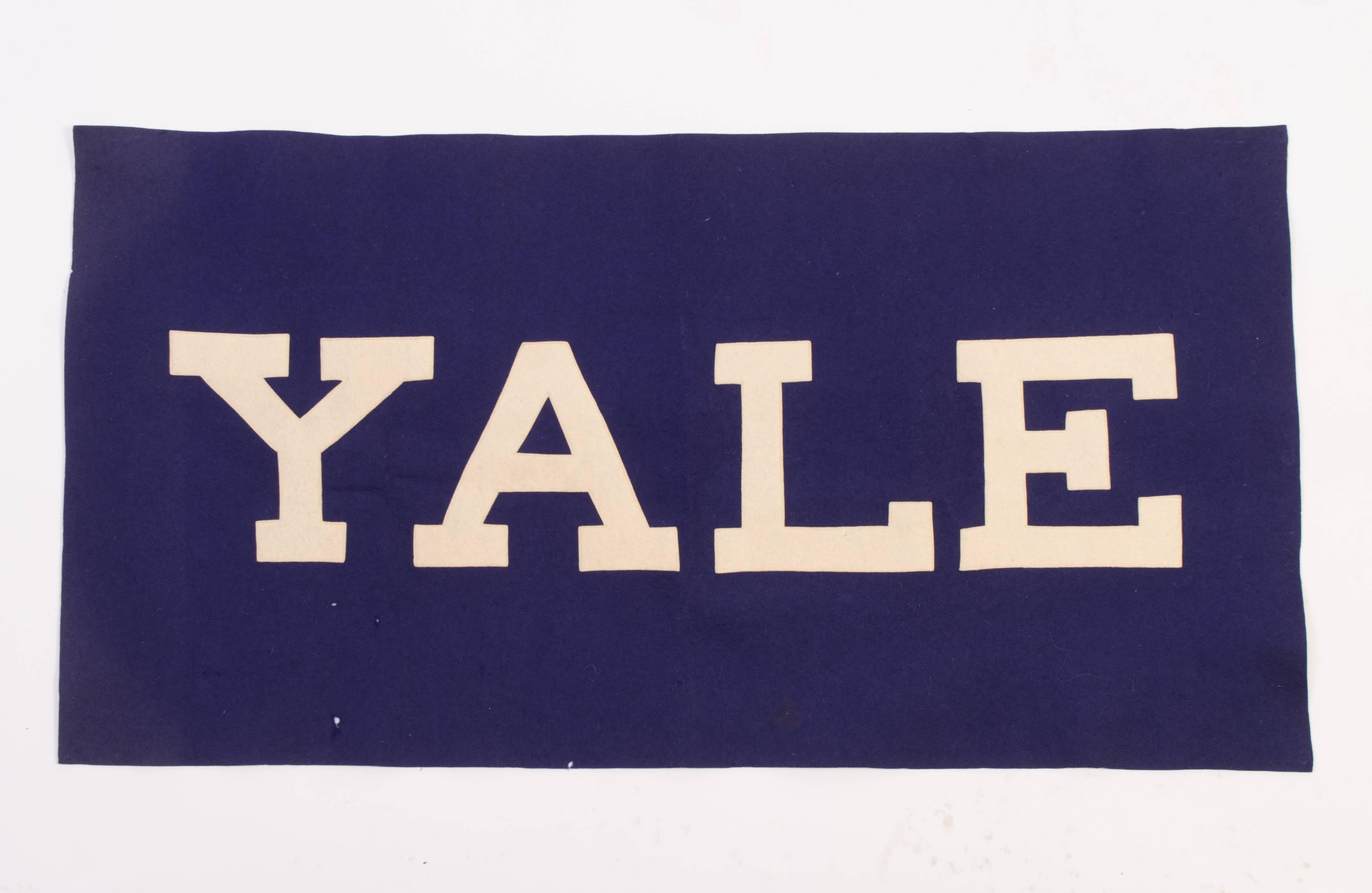 A great example of a felt Yale banner, circa 1940s. Color still well in tact as is the sewn typography. Few small pin holes around the banner, certainly not taking away from the Yale spirit.