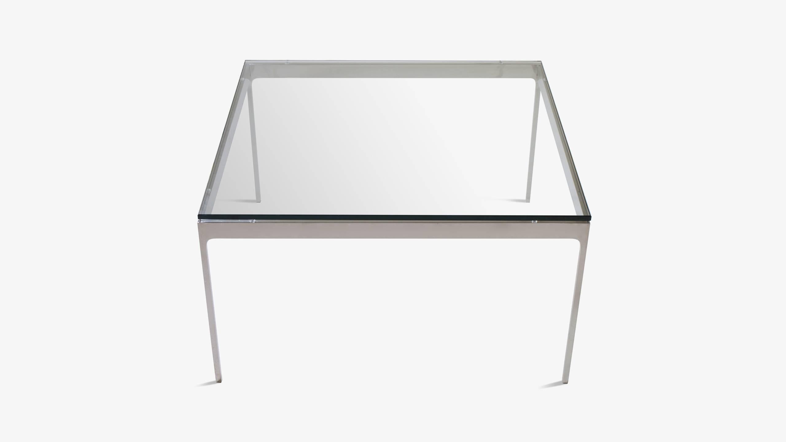 The essence of minimalism exists in this subtle design by Nicos Zographos. Solid stainless steel stock creates a Classic Mid-Century frame with some graceful additions. Zographos' attention to detail is noted by the delicate curved corners which