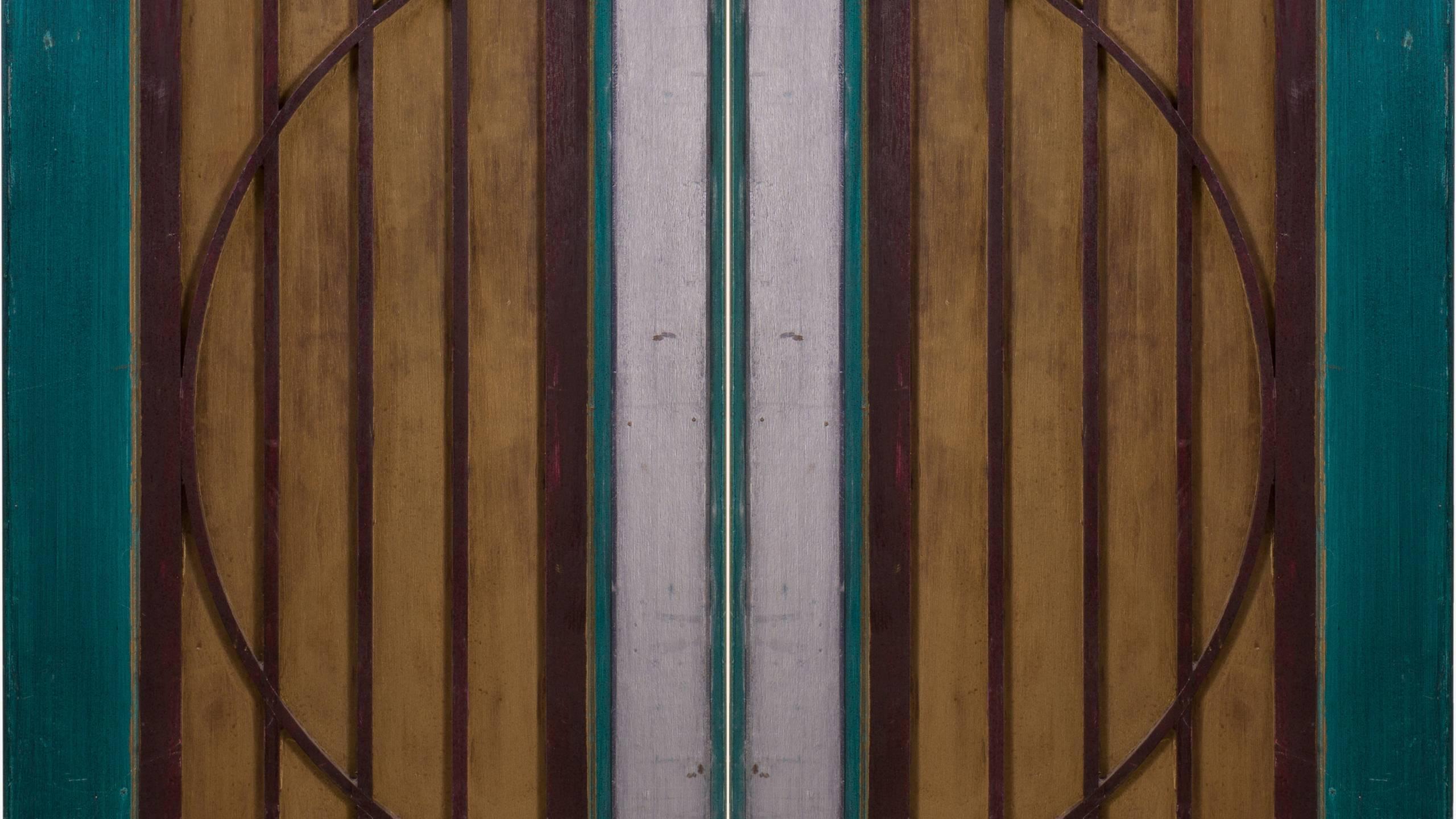 A pair of decorative Art-Deco inspired wood doors from Goodspeed Opera House in East Haddam, Connecticut. Most likely used on the stage set or as an architectural element, they delightfully embody the spirit of Art-Deco Design. These would be great