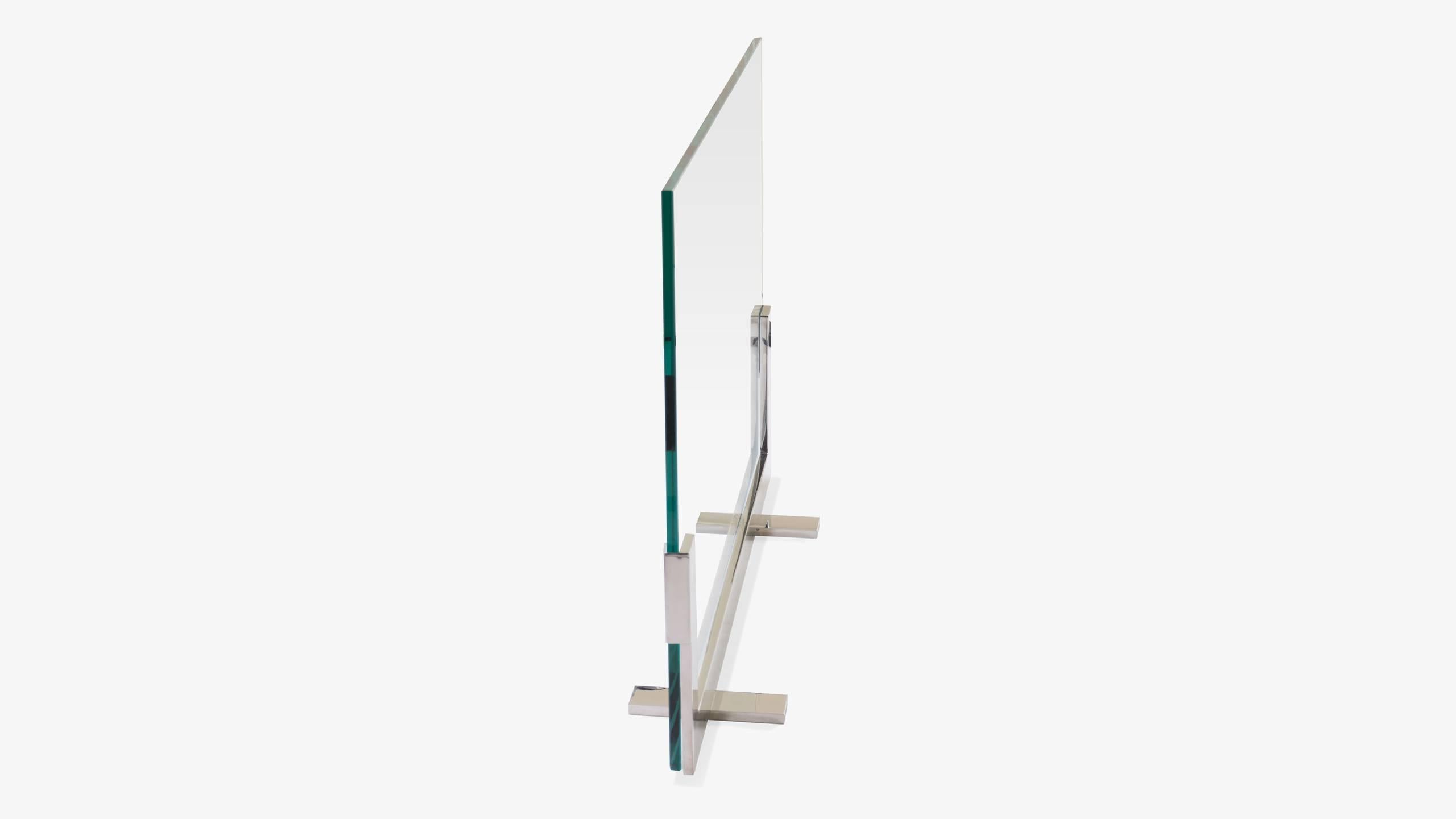An elegant and unexpected fire screen design fit for a true modernist. A simple polished stainless steel frame accepts an impeccable piece of 3/8