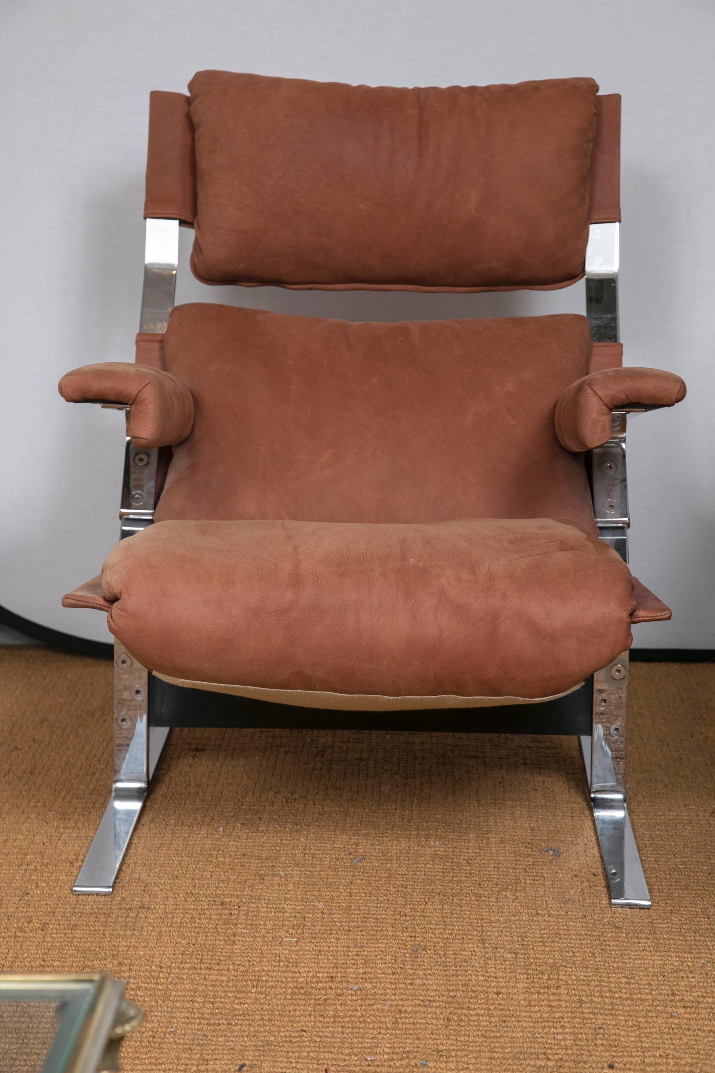 A vintage Mid-Century distressed leather and polished chrome lounge chair and ottoman, designed by  Richard Hersberger for Pace. Incredibly comfortable. You'll never want to get up. Measures: 28.0ʺ W × 39.0ʺ D × 37.0ʺ H, 15