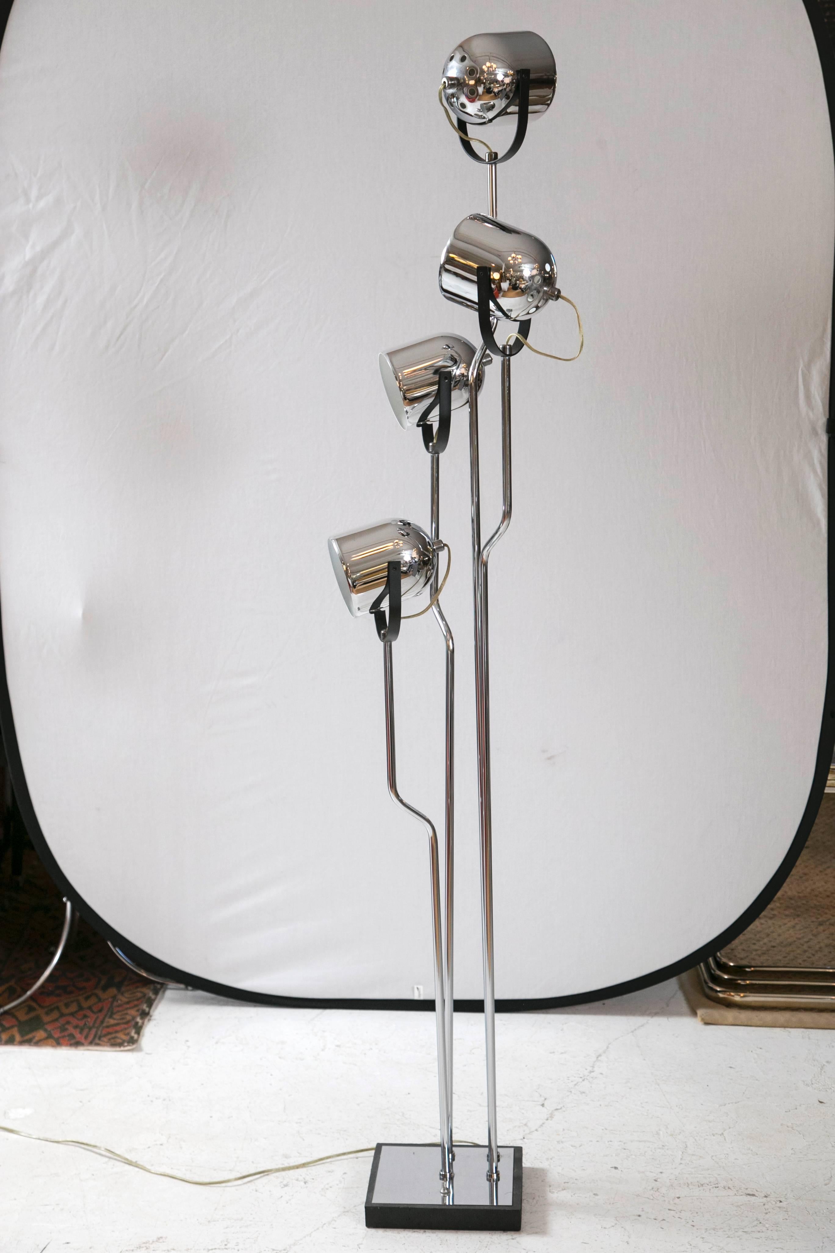 Classic Italian. Chic four-head completely rotatable floor lamp by Reggiani. Each rod rotates and each head adjusts up and down. Black metal accents throughout the piece accentuate the crispness of the chrome. Stunning piece. 60 watts recommended